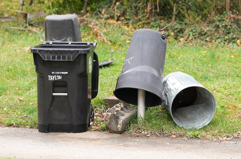 A pile of empty trash cans in an alley in northeast Baltimore, Md. on Thursday, April 3, 2025.