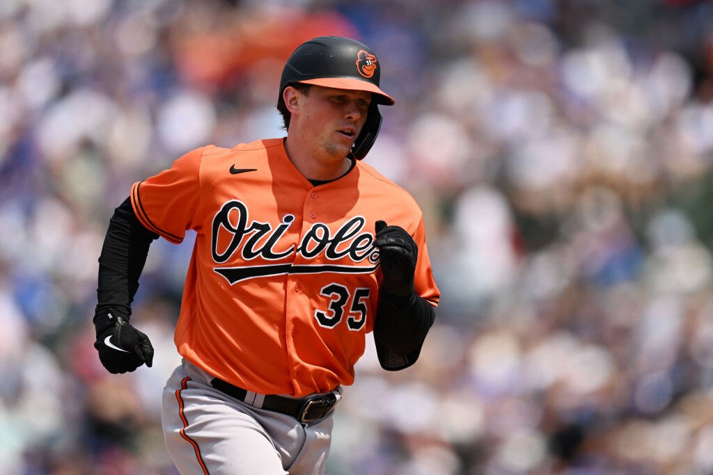 CHICAGO, ILLINOIS - JUNE 17: Adley Rutschman #35 of the Baltimore Orioles hits a two-run home run in the fifth inning against the Chicago Cubs at Wrigley Field on June 17, 2023 in Chicago, Illinois. (Photo by Quinn Harris/Getty Images)