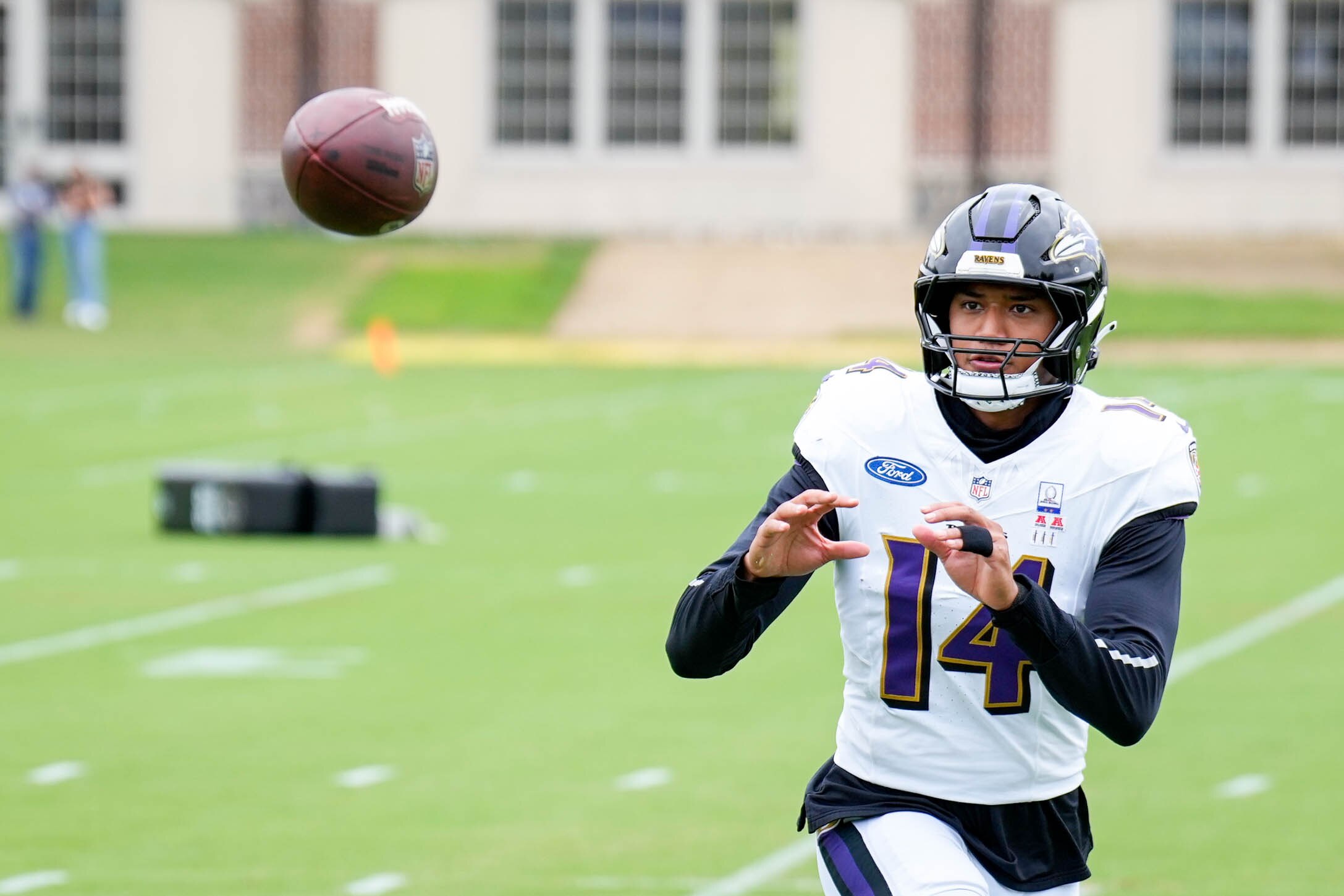 Baltimore Ravens safety Kyle Hamilton (14) completes a drill during the team’s training camp at the Under Armour Performance Center in Owings Mills, Md. on Tuesday, August 19, 2025.