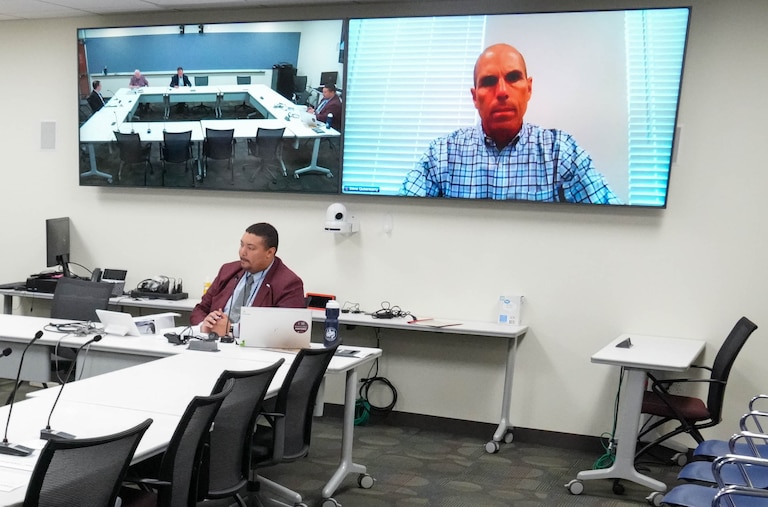 Board member Steven Quisenberry, on screen, virtually attends a meeting of the Howard County Inspector General Advisory Board chaired by David Salem, center left, and attended by other members of the board at the George Howard Building in Ellicott City, Md. on Thursday, August 28, 2025.