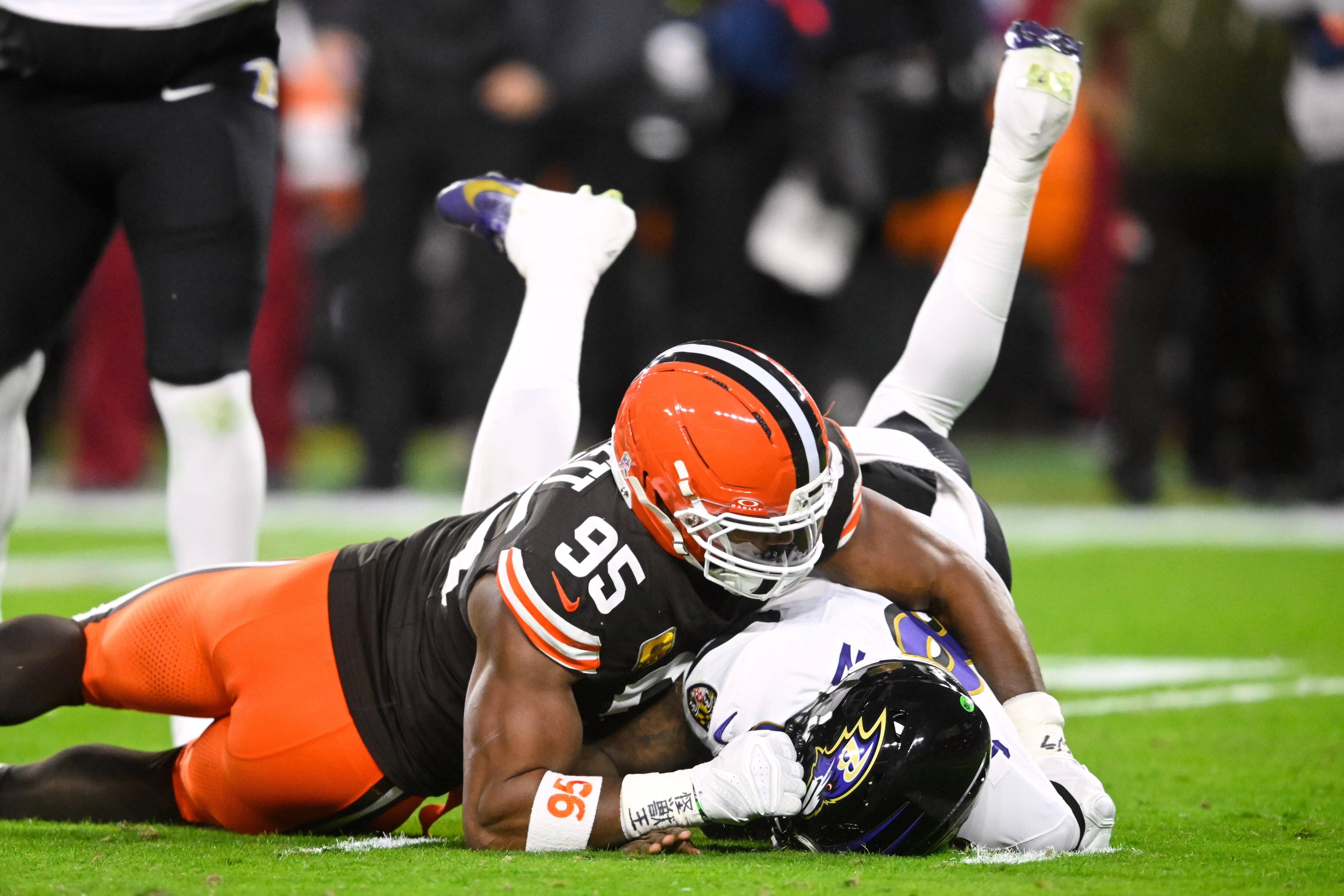Browns defensive end Myles Garrett finishes one of his four sacks of the Ravens’ Lamar Jackson on Sunday in Cleveland.