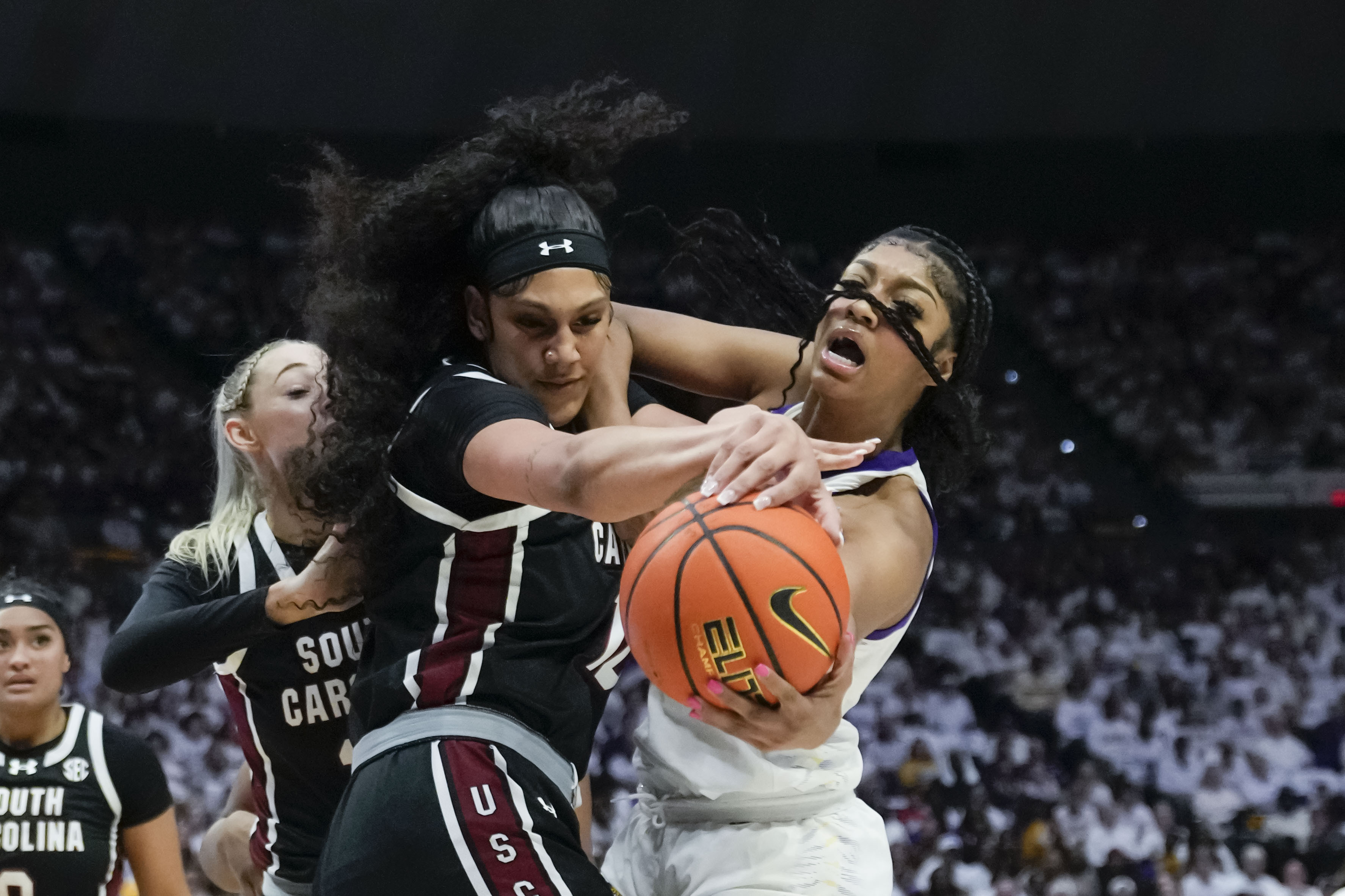 LSU forward Angel Reese, right, and South Carolina center Kamilla Cardoso battle under the basket in the first half of the South Carolina win Thursday night.