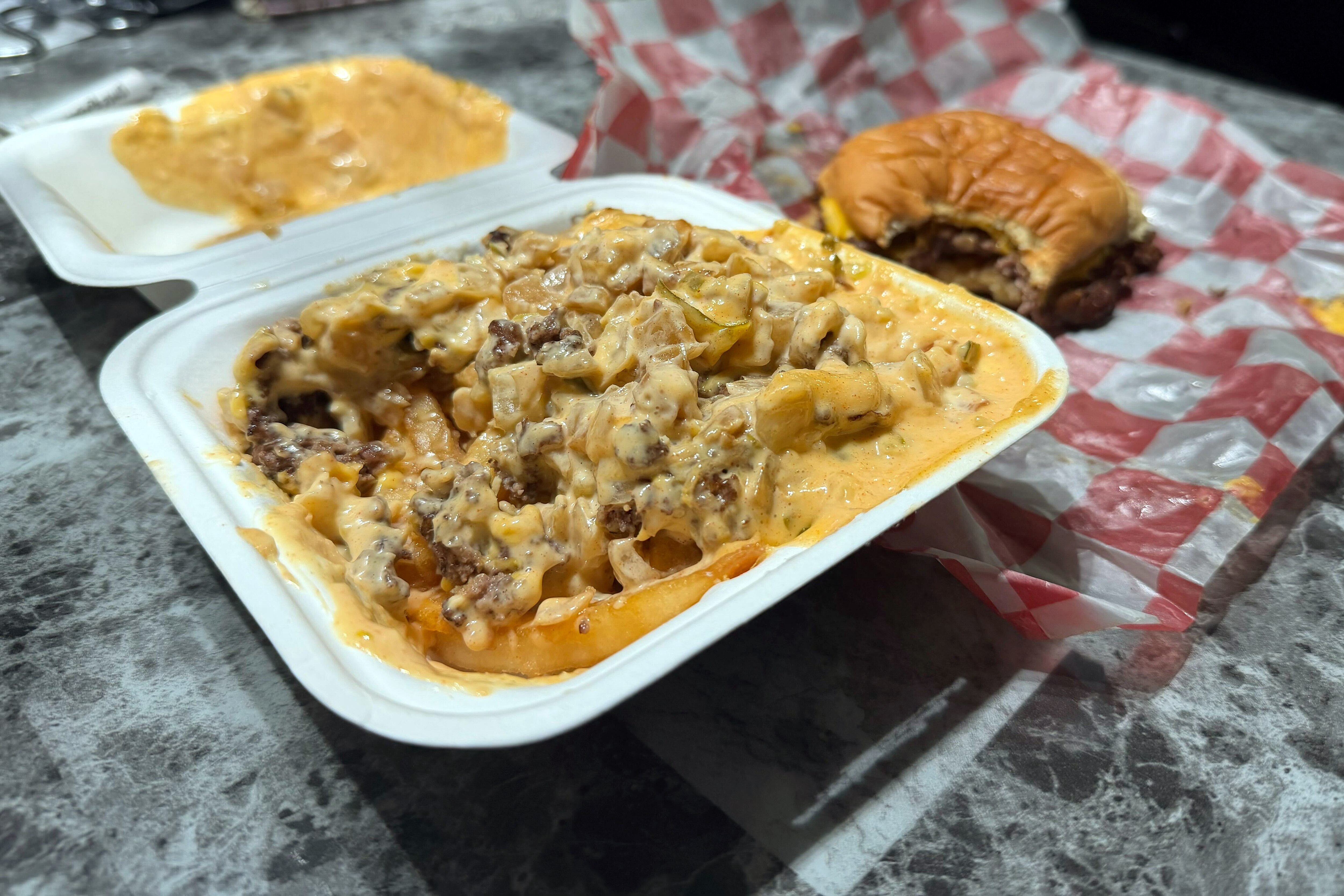 7th Street Burger has a loaded fries option that comes with a house sauce, grilled onions and a burger patty.