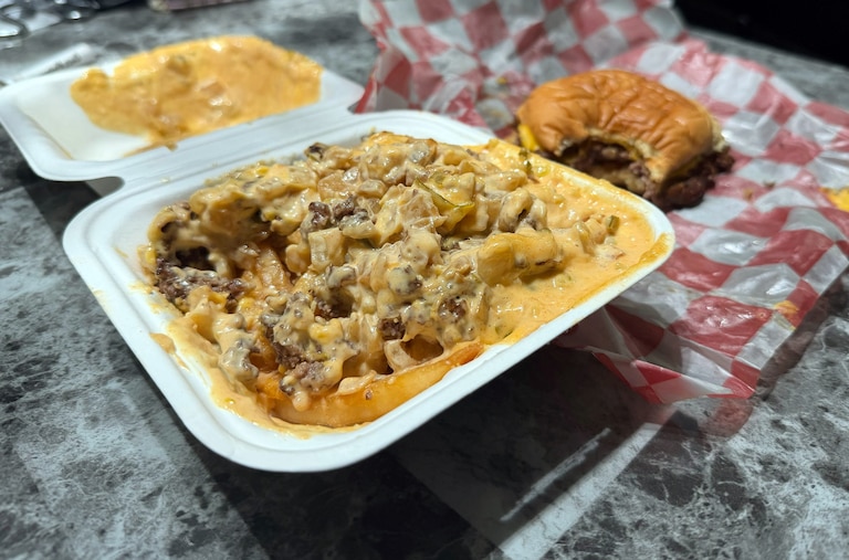 7th Street Burger has a loaded fries option that comes with a house sauce, grilled onions and a burger patty.