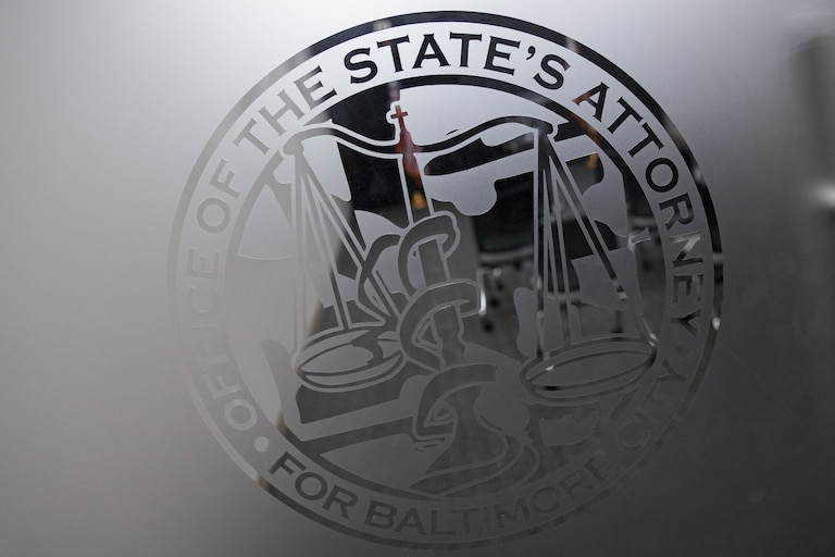 The logo for the Baltimore City State’s Attorney etched into a glass door.