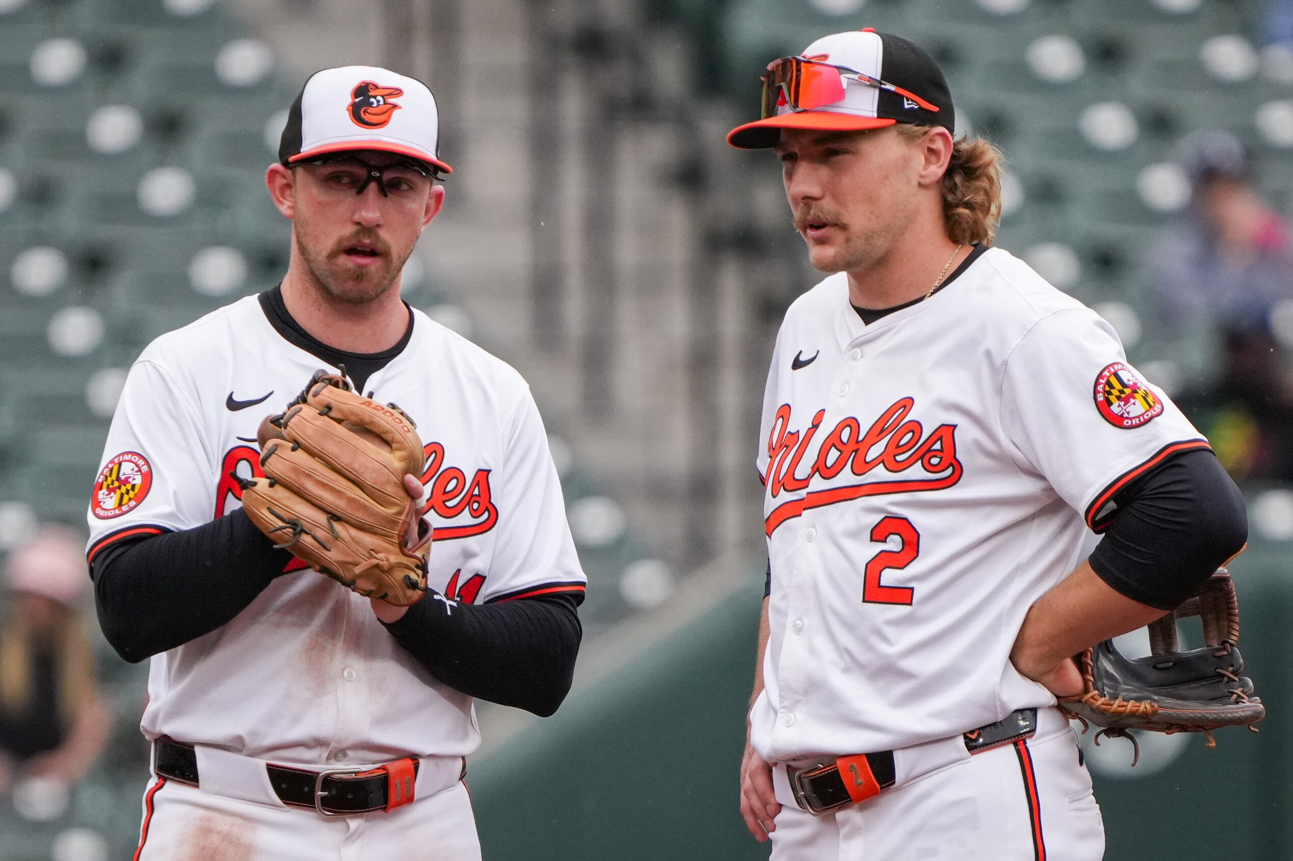 Baltimore Orioles third baseman Jordan Westburg (11) and shortstop Gunnar Henderson (2) speak during a mound meeting on April 17.