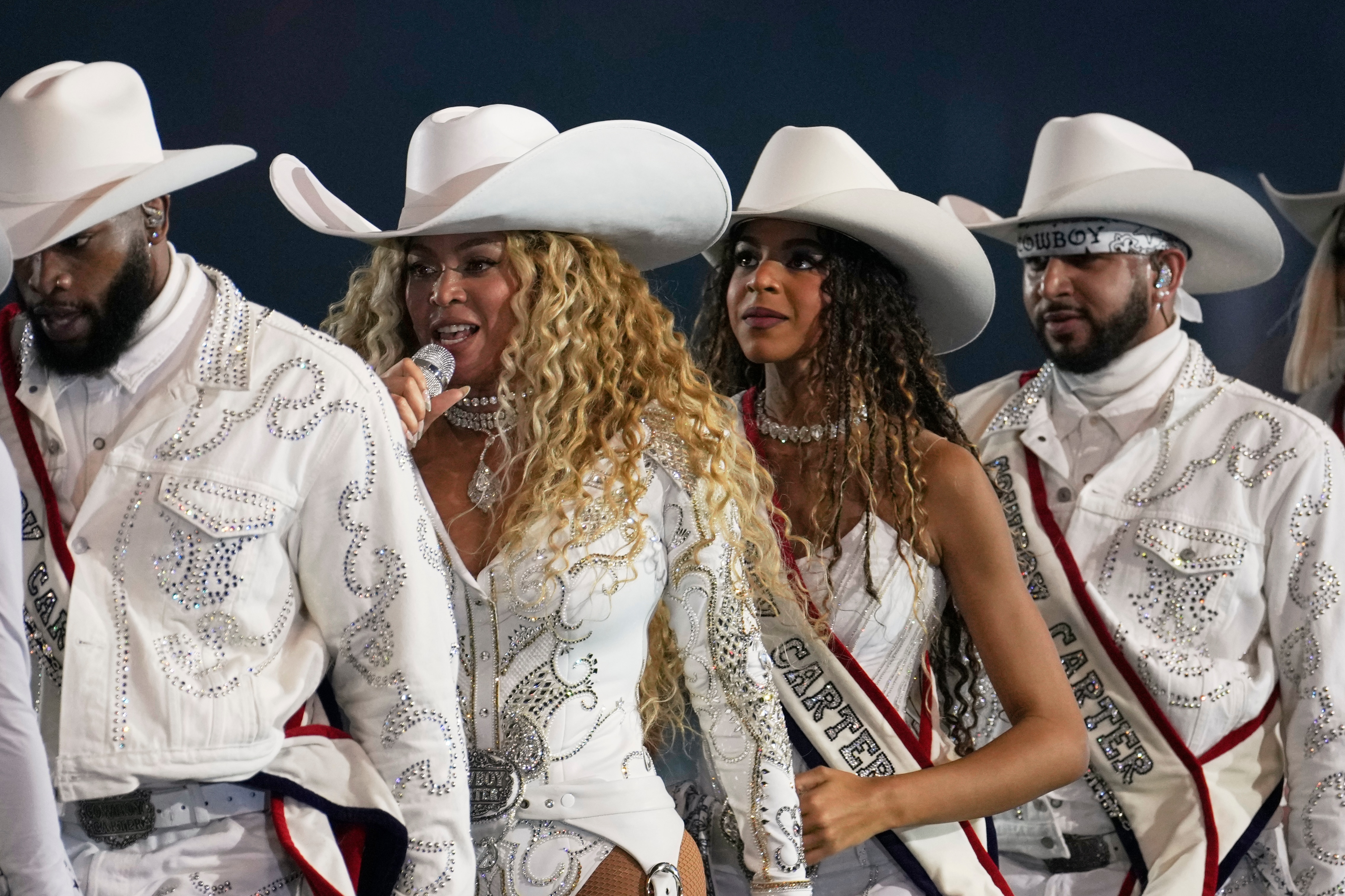 FILE - Beyoncé, center left, and her daughter, Blue Ivy Carter, perform during halftime of an NFL football game between the Baltimore Ravens and Houston Texans Wednesday, Dec. 25, 2024, in Houston.