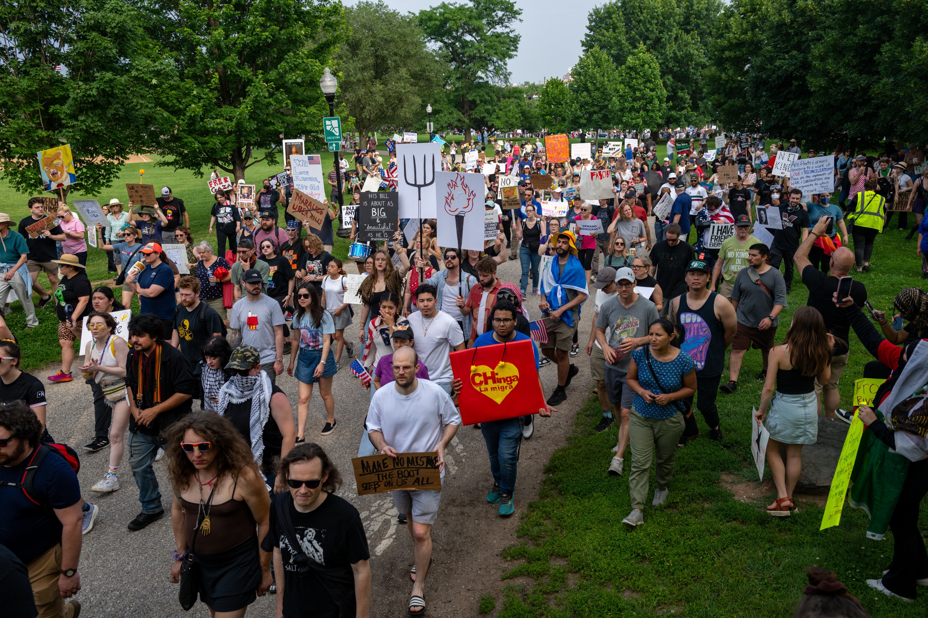 Protesters march around Patterson Park in Baltimore on Saturday, during one of many "No Kings" protests being held around the country.