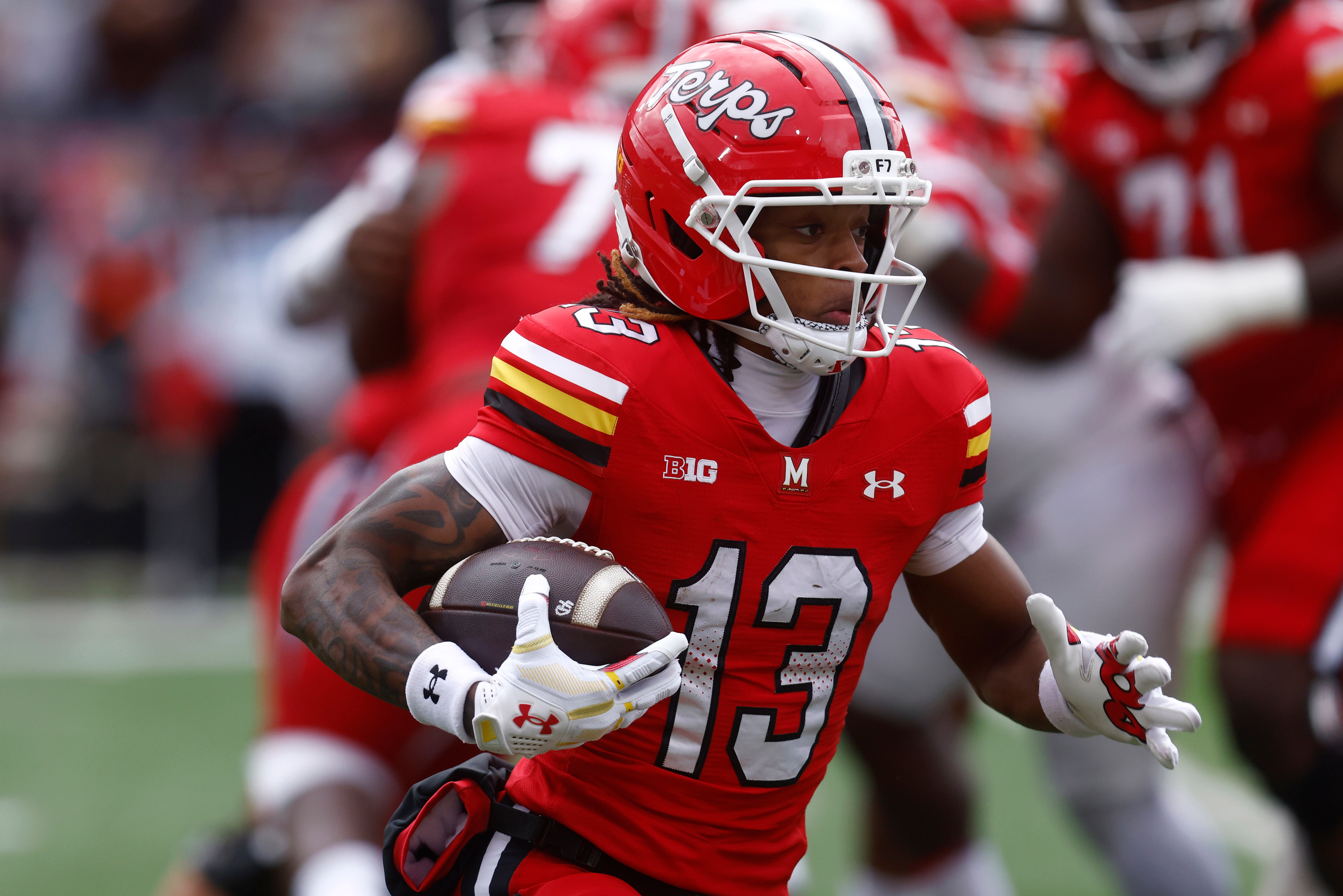 Maryland wide receiver Chris Durr Jr. (13) runs the football during an NCAA football game against Rutgers on Saturday, Oct. 17, 2026 in College Park, Md. (AP Photo/Mike Buscher)