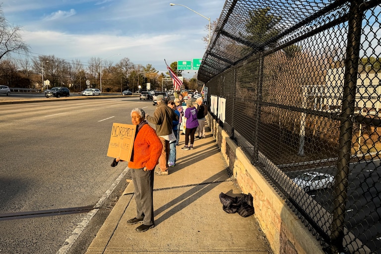 THURSDAY, JANUARY 8, 2025 - A couple dozen protesters gather with signs at the Colesville Road overpass at I-495 in Silver Spring, the day after an ICE shooting in Minneapolis, Minn.