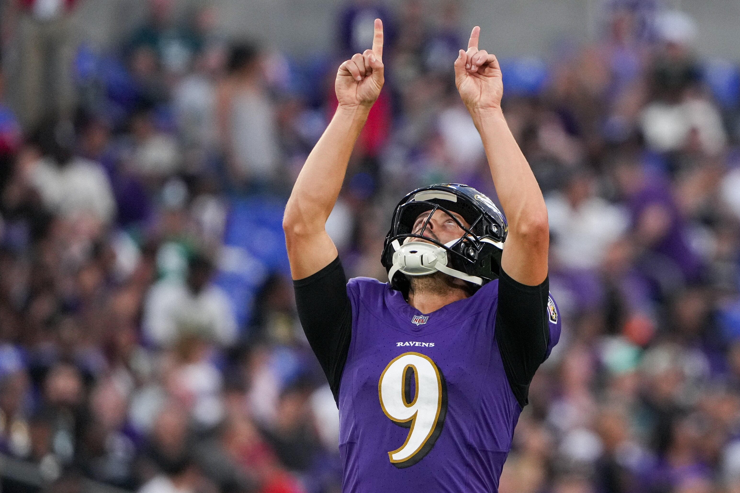 Ravens kicker Justin Tucker celebrates his 60-yard field goal at the end of the first half of Saturday night's 20-19 preseason victory over the Eagles.
