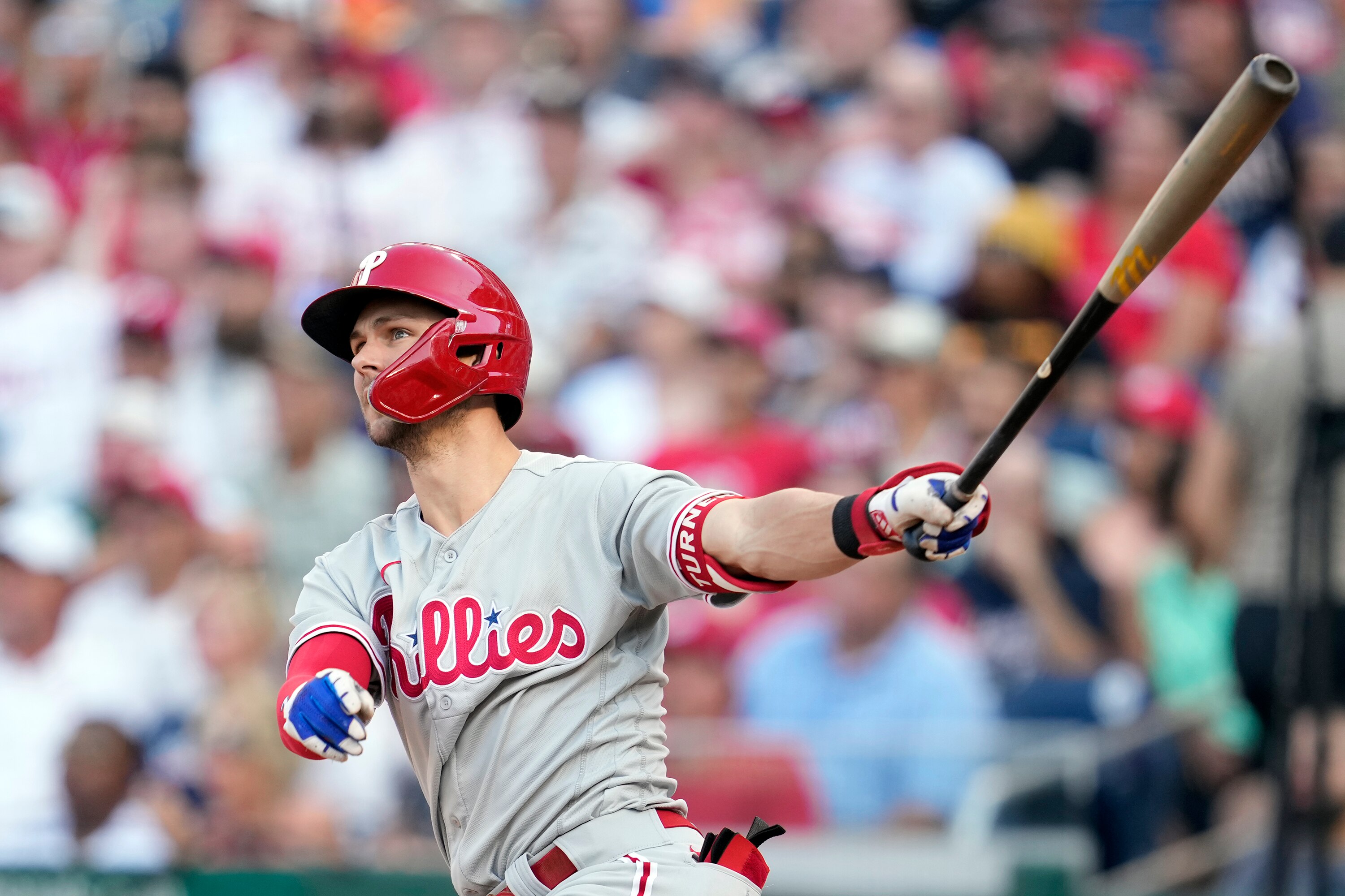 Former National Trea Turner watches the second of his two eighth-inning solo home runs during the Phillies' 12-3 win Saturday.
