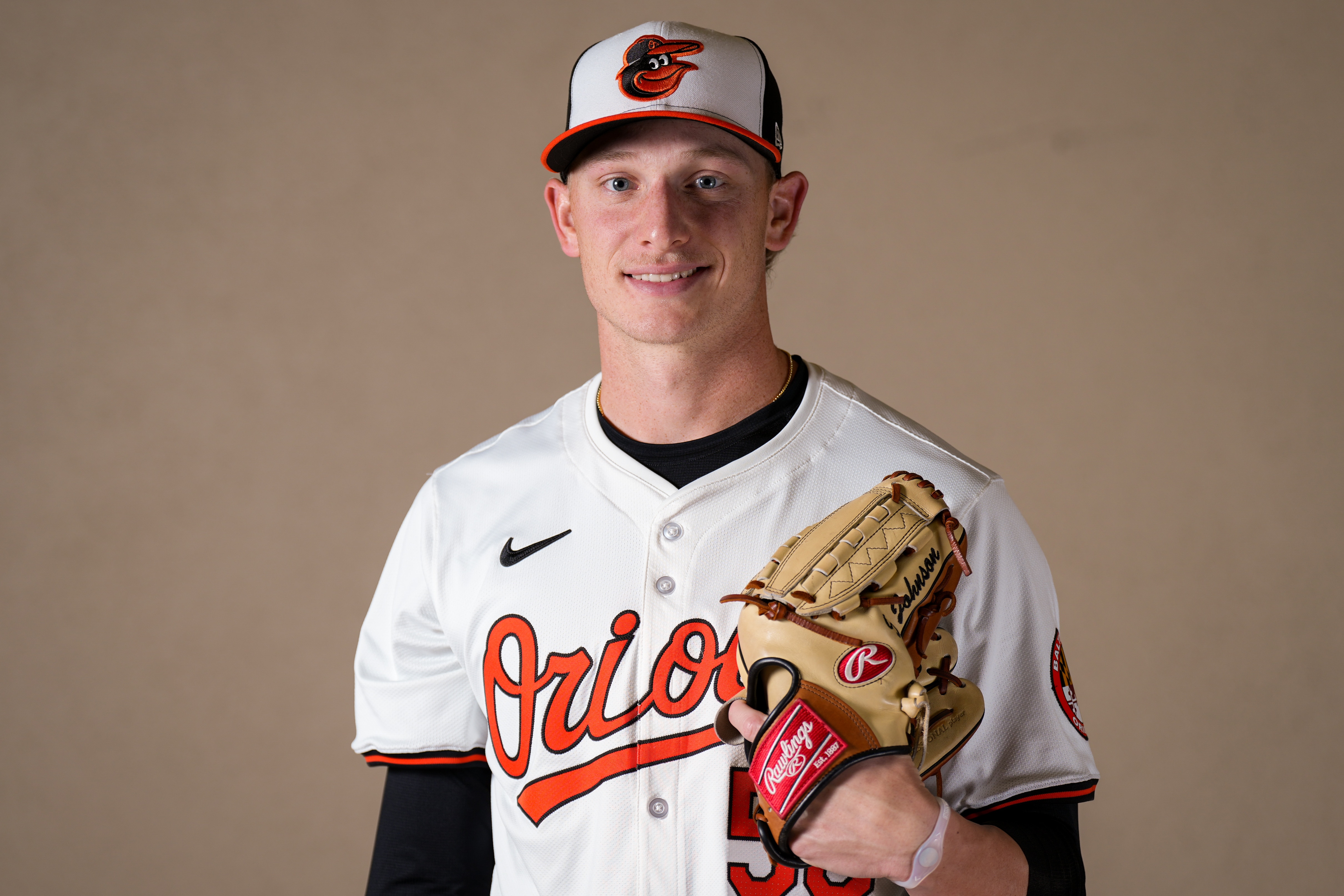 Baltimore Orioles starting pitcher Seth Johnson (56) poses for a portrait during the Baltimore Orioles’ team picture day during spring training at Ed Smith Stadium on Feb. 21, 2024.