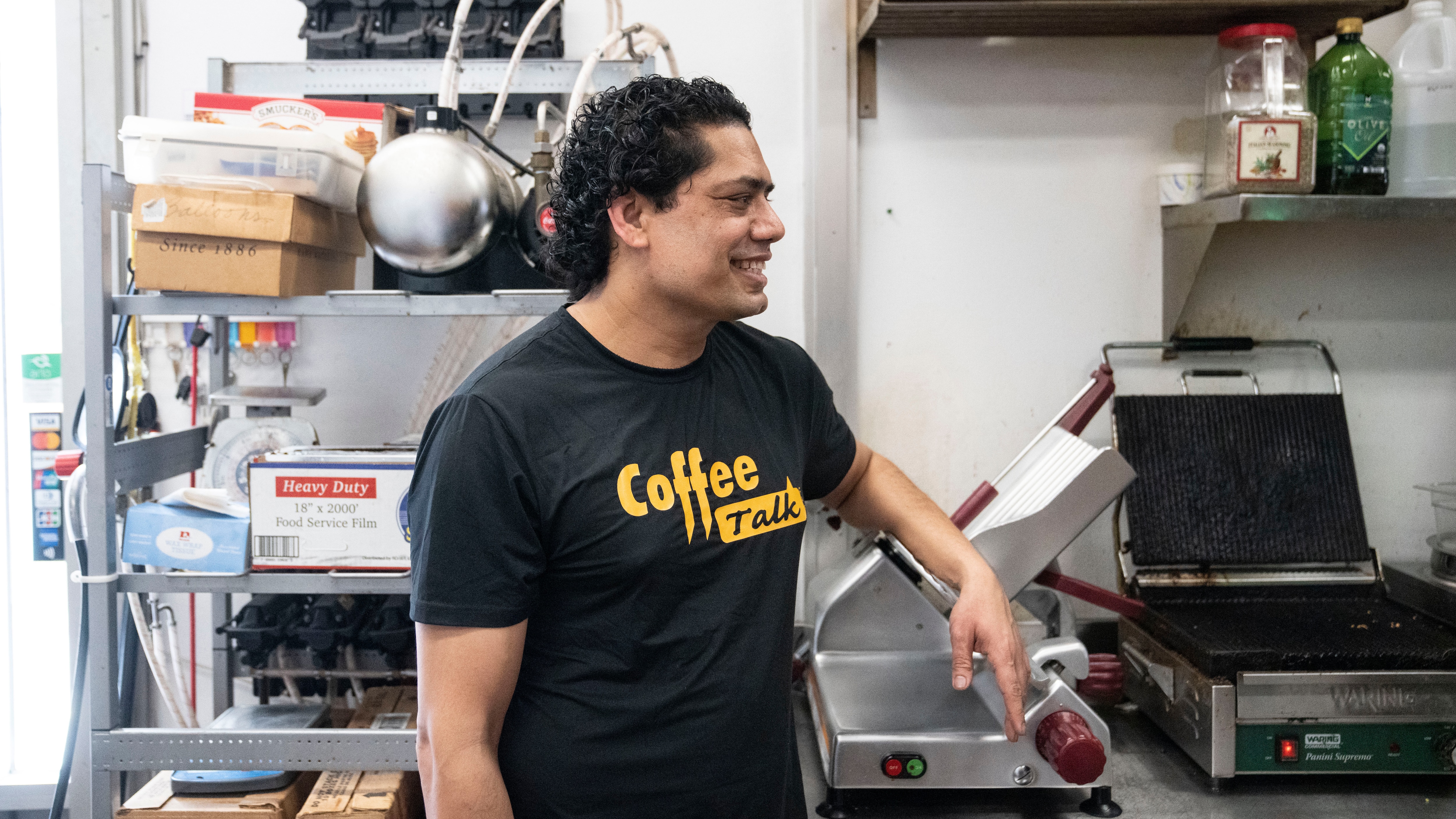 Nara Khakurel at his cafe, Coffee Talk Cafe, in Towson.
