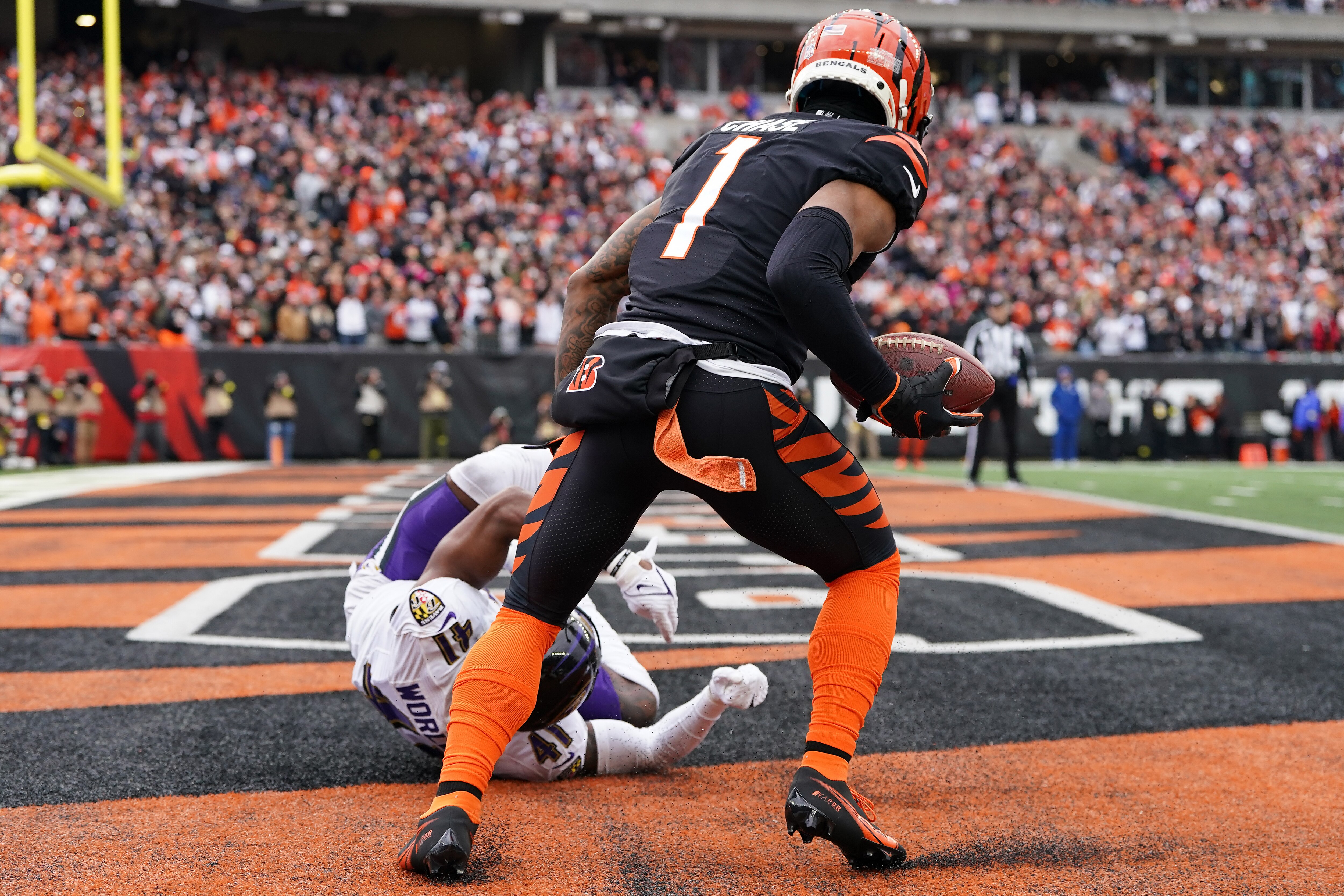 CINCINNATI, OHIO - JANUARY 08: Ja'Marr Chase #1 of the Cincinnati Bengals catches a pass over Daryl Worley #41 of the Baltimore Ravens for a touchdown during the second quarter at Paycor Stadium on January 08, 2023 in Cincinnati, Ohio. (Photo by Dylan Buell/Getty Images)