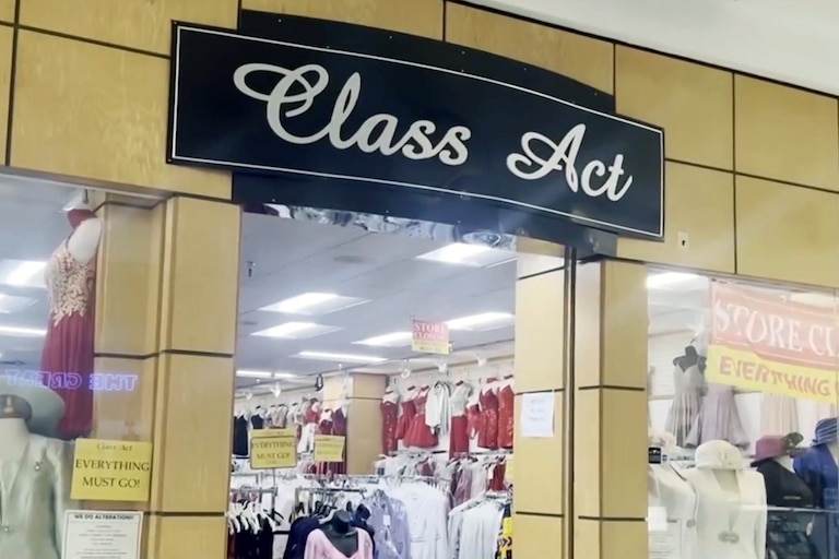 Formal wear store Class Act in Eastpoint mall with Store Closing signs in the window.