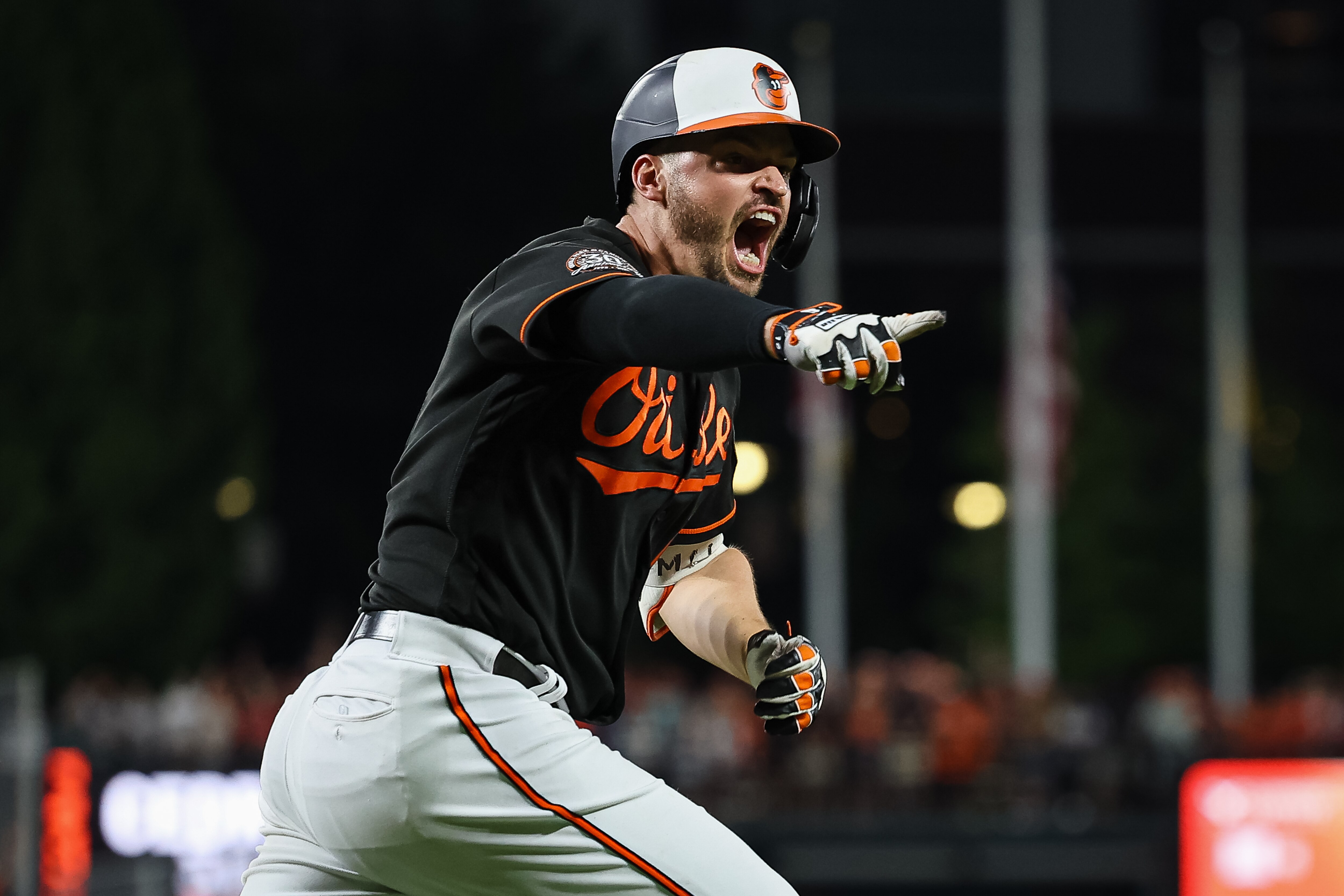 BALTIMORE, MD - JULY 08: Trey Mancini #16 of the Baltimore Orioles celebrates after hitting a walk off single against the Los Angeles Angels during the ninth inning at Oriole Park at Camden Yards on July 8, 2022 in Baltimore, Maryland. (Photo by Scott Taetsch/Getty Images)