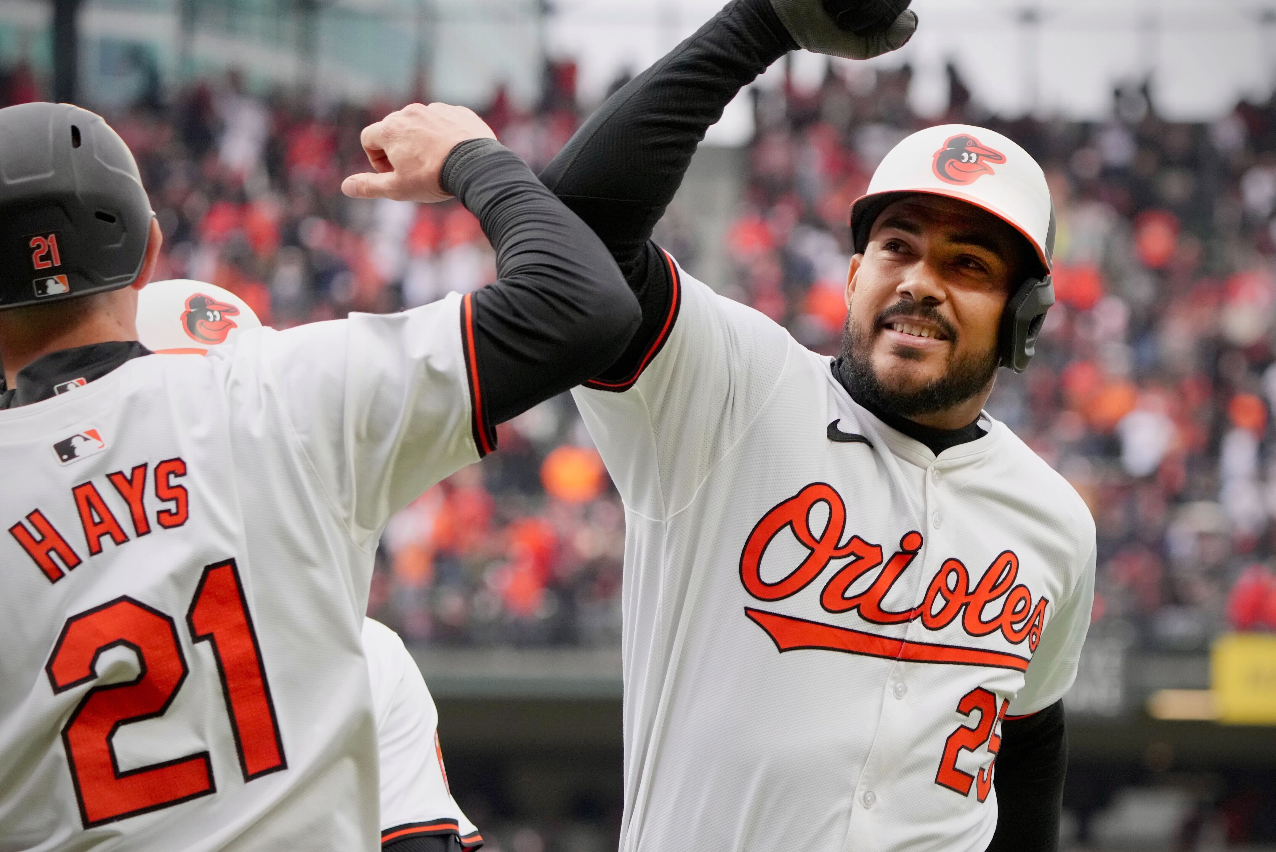 Anthony Santander celebrates the Orioles' first home run of the season with Austin Hays.