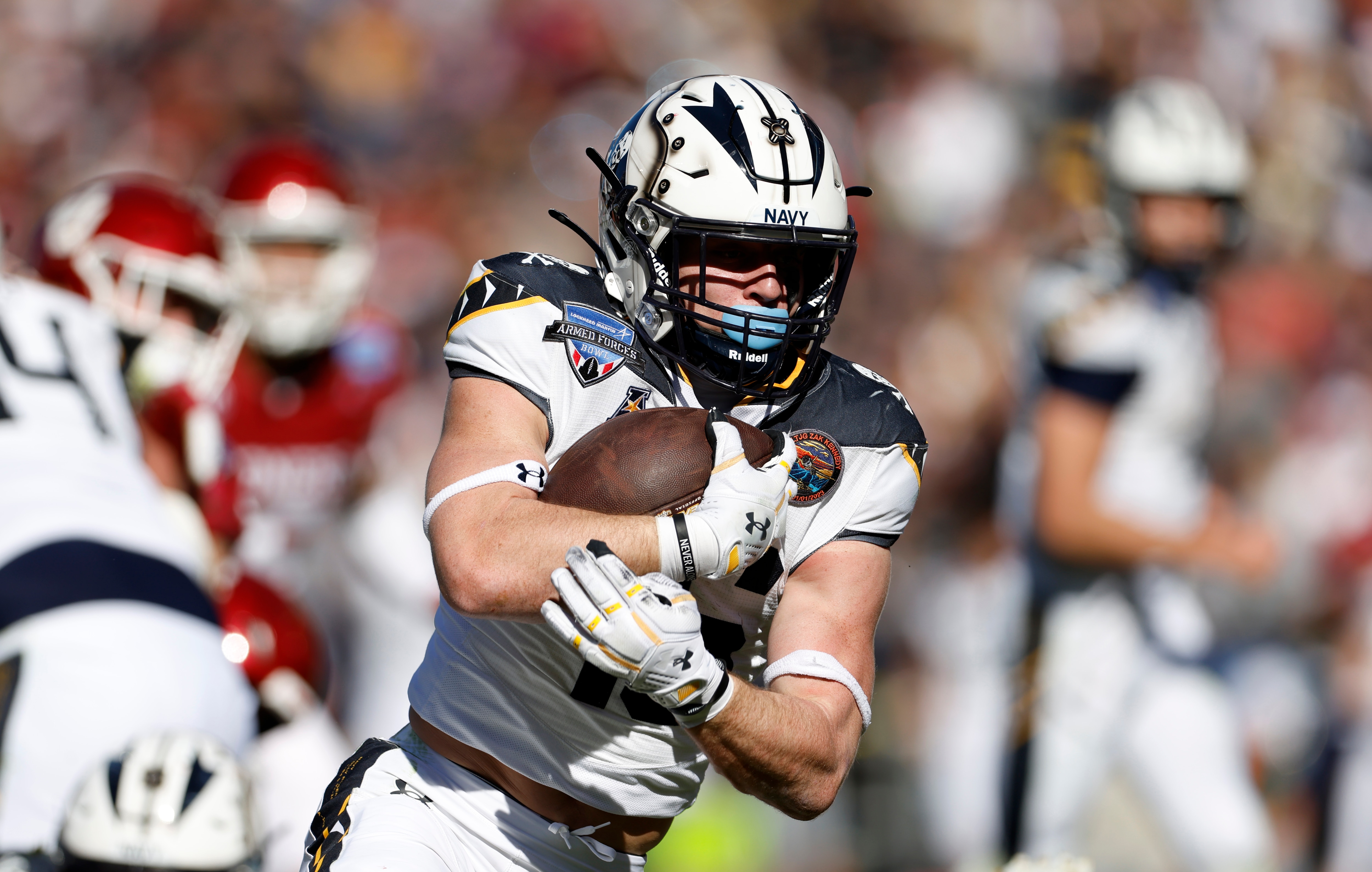 Navy’s Alex Tecza, shown in last season’s Armed Forces Bowl against Oklahoma, ran for 104 yards Saturday against Rice.