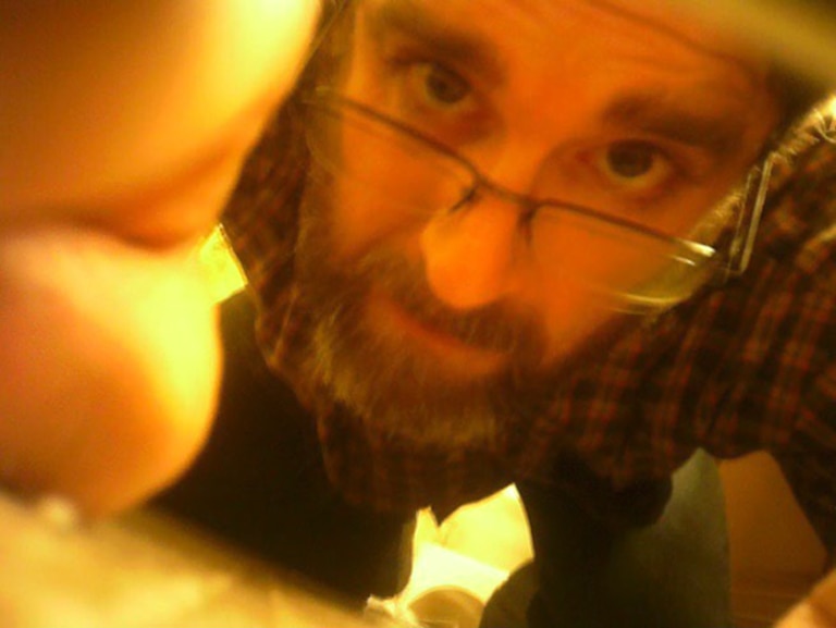 A still from a video, included in court filings, shows Ryan Hall adjusting a covert camera in a bathroom.