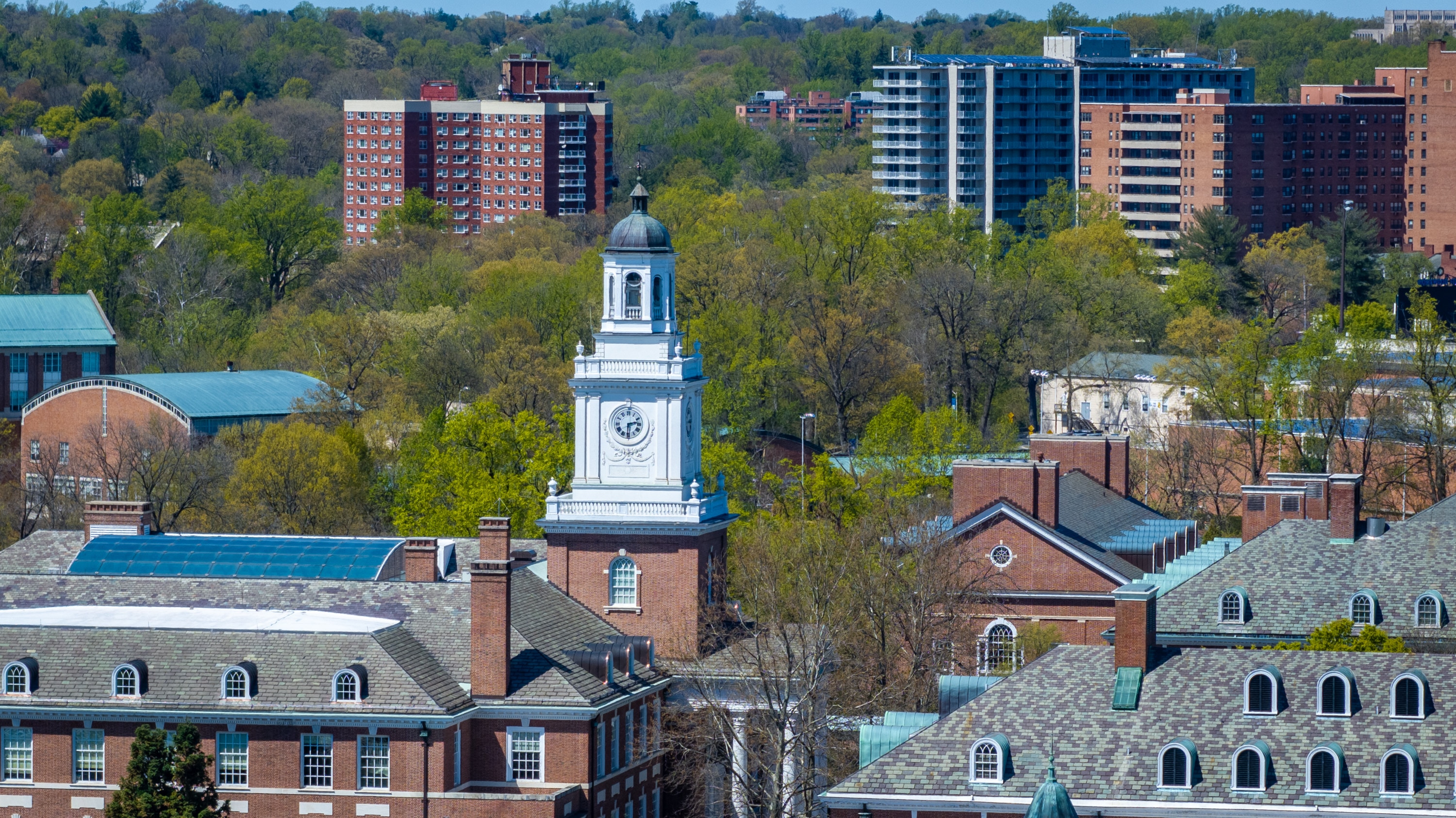 The Gilman Hall cupola is seen above the Johns Hopkins University Homewood campus on Thursday, April 17, 2025.