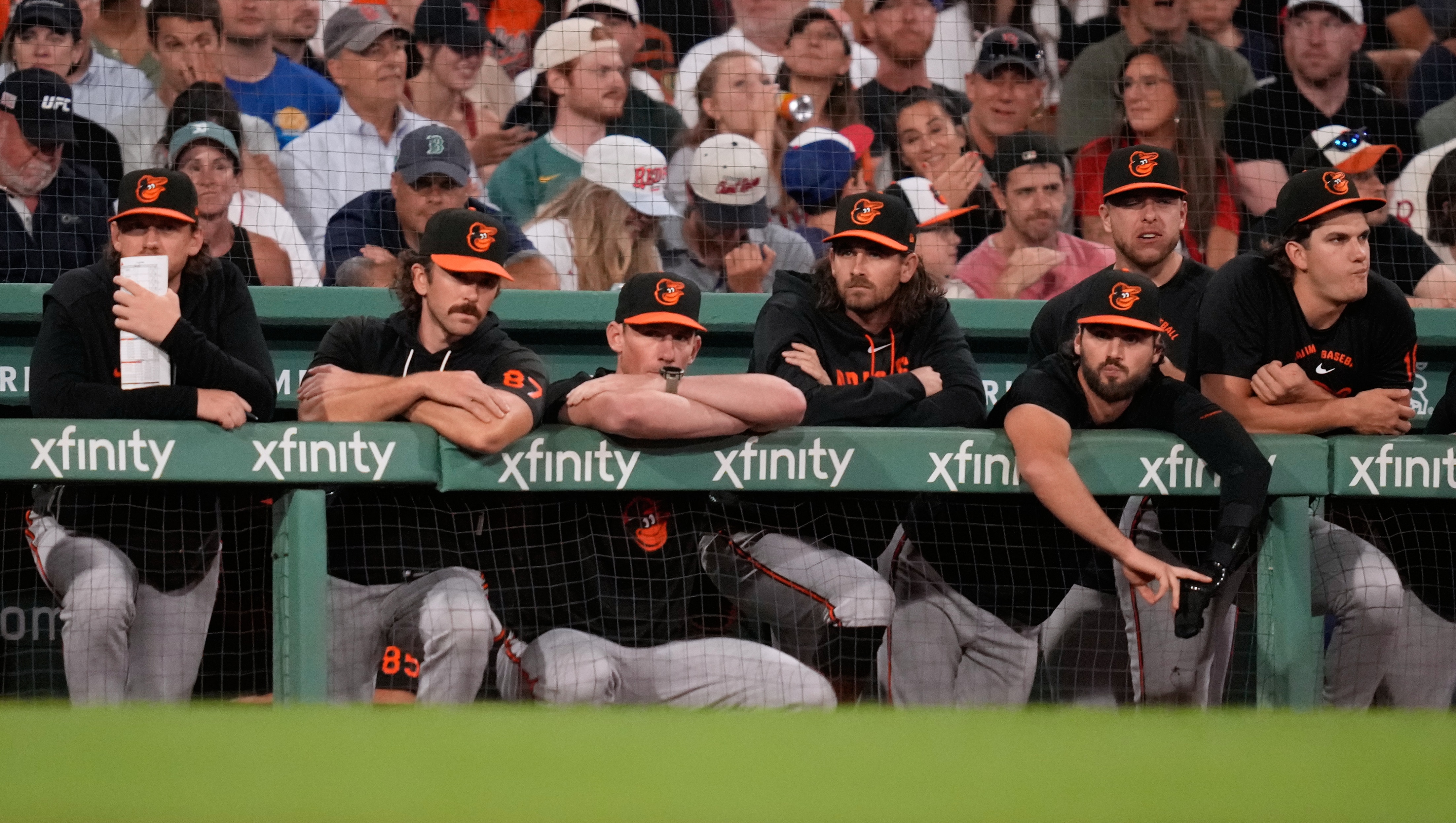 Baltimore Orioles players watch from the dugout rail after a solo home run by Boston Red Sox's Caleb Durbin in the eighth inning.