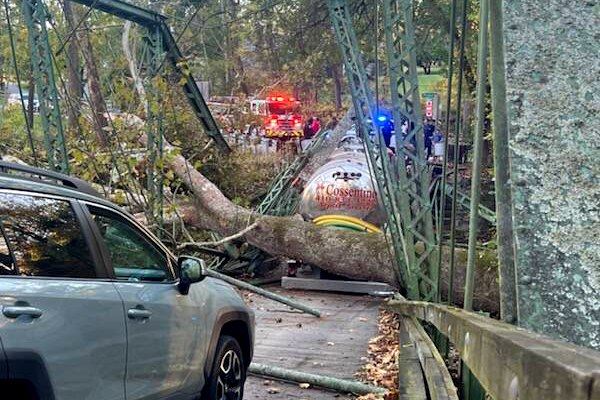 Baltimore County Fire crews respond to a call about a septic truck involved in the collapse of a bridge in Phoenix, Md., on Monday, October 20, 2025.