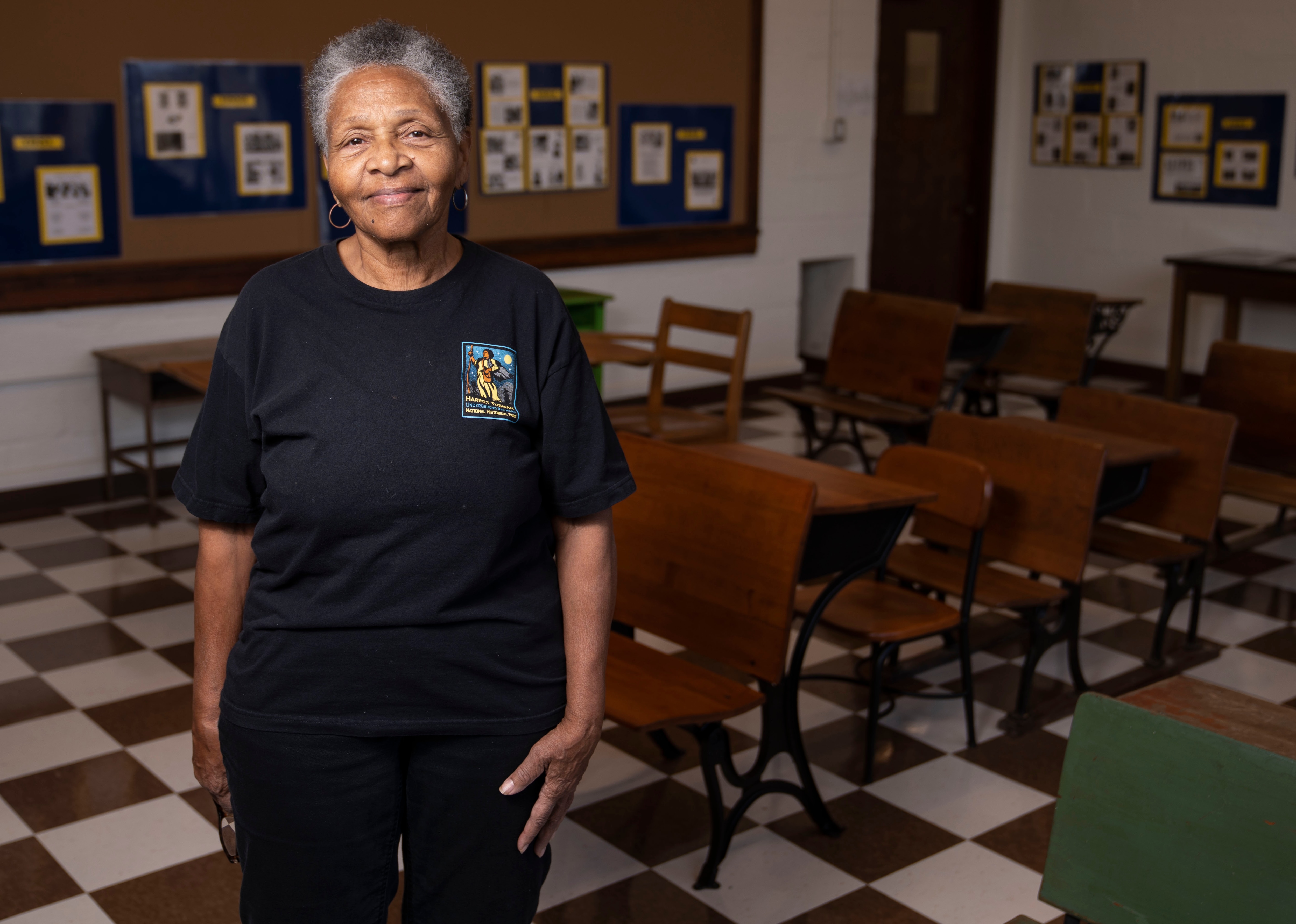 Harriet Tubman Foundation President, Bessie Bordenave, and a 1962 graduate of the Harriet Tubman School, poses for a portrait inside of the Bernice Beaird Recreated Classroom at the Harriet Tubman Cultural Center, Tuesday, February 21, 2023.