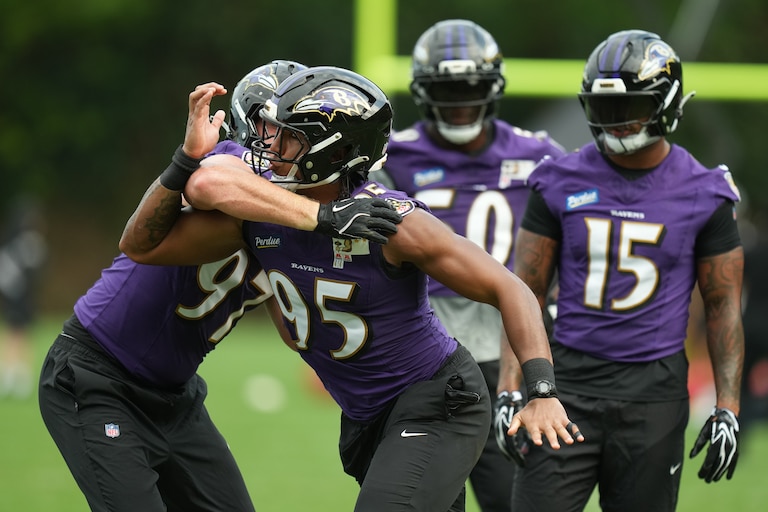 Baltimore Ravens linebacker Ethan Burke (97) and linebacker Tavius Robinson (95) work out during a practice for an NFL football game against the Dallas Cowboys in Rio de Janeiro, Friday, Sept. 25, 2026. (AP Photo/Andre Penner)