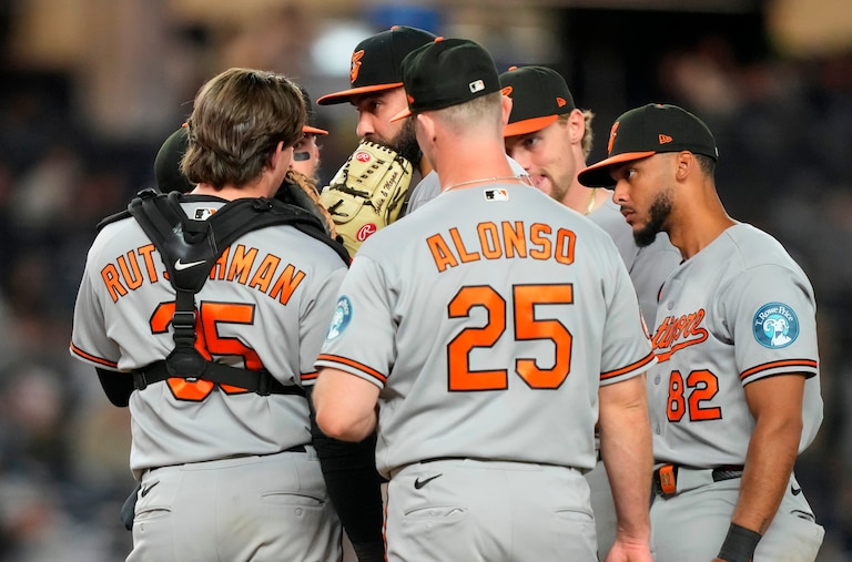 Orioles pitcher Lou Trivino speaks to teammates during the eighth inning of Monday night's game against the Yankees.