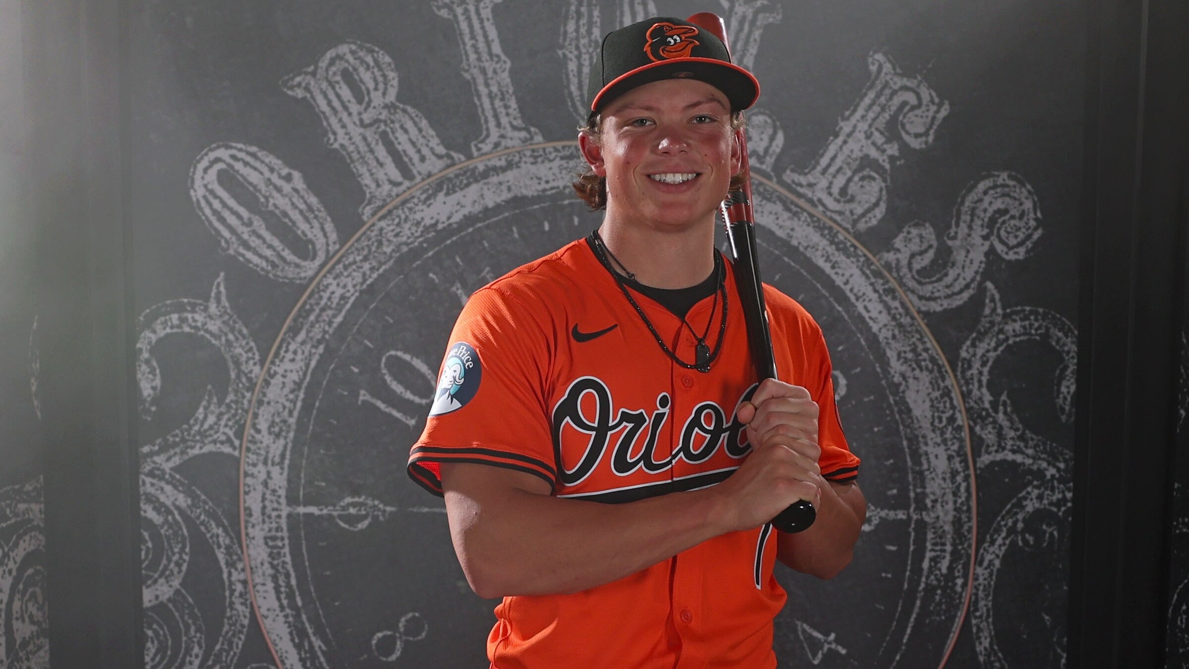 Jackson Holliday models the throwback all-orange uniform.