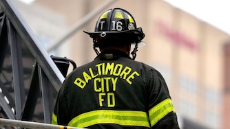 A Baltimore City firefighter on the scene of a fire in Downtown Baltimore on Sept. 22, 2024.
