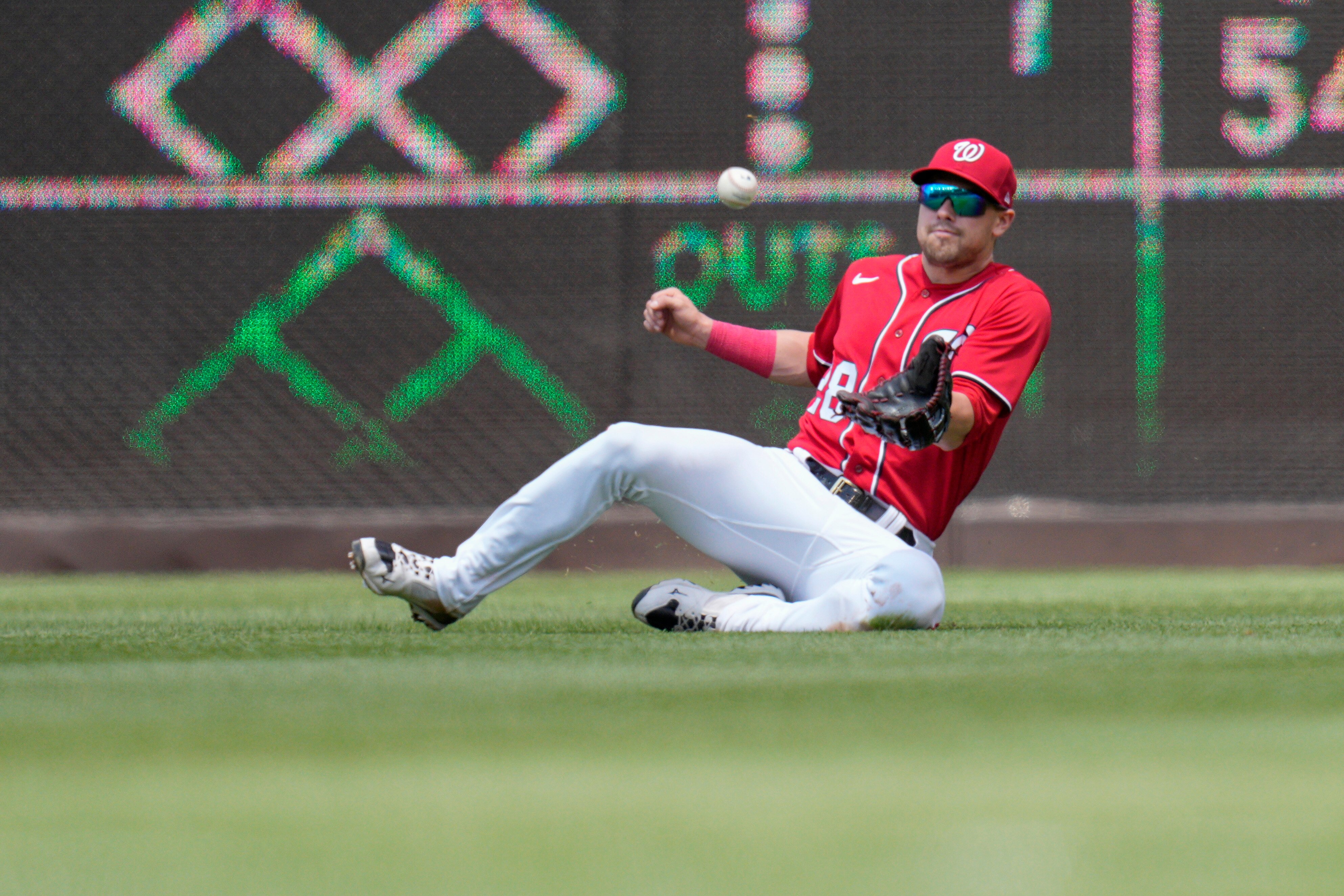 WASHINGTON, DC - JUNE 04: Lane Thomas #28 of the Washington Nationals catches a ball hit by Brandon Marsh #16 of the Philadelphia Phillies during the third inning at Nationals Park on June 04, 2023 in Washington, DC.