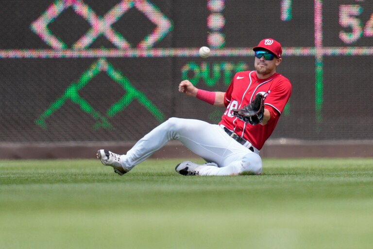 WASHINGTON, DC - JUNE 04: Lane Thomas #28 of the Washington Nationals catches a ball hit by Brandon Marsh #16 of the Philadelphia Phillies during the third inning at Nationals Park on June 04, 2023 in Washington, DC.