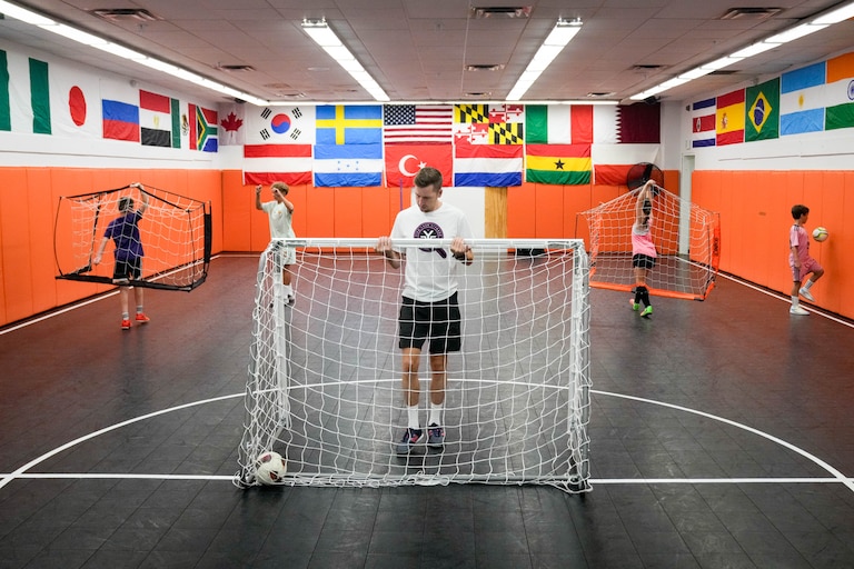 Hendrik de Wit, founder of Find Your Finesse, readjusts a goal as his students set up additional goals at his futsal training center inside the Eastpoint Mall in Dundalk, Md. on Monday, August 17, 2026.