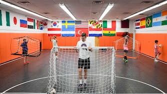 Hendrik de Wit, founder of Find Your Finesse, readjusts a goal as his students set up additional goals at his futsal training center inside the Eastpoint Mall in Dundalk, Md. on Monday, August 17, 2026.