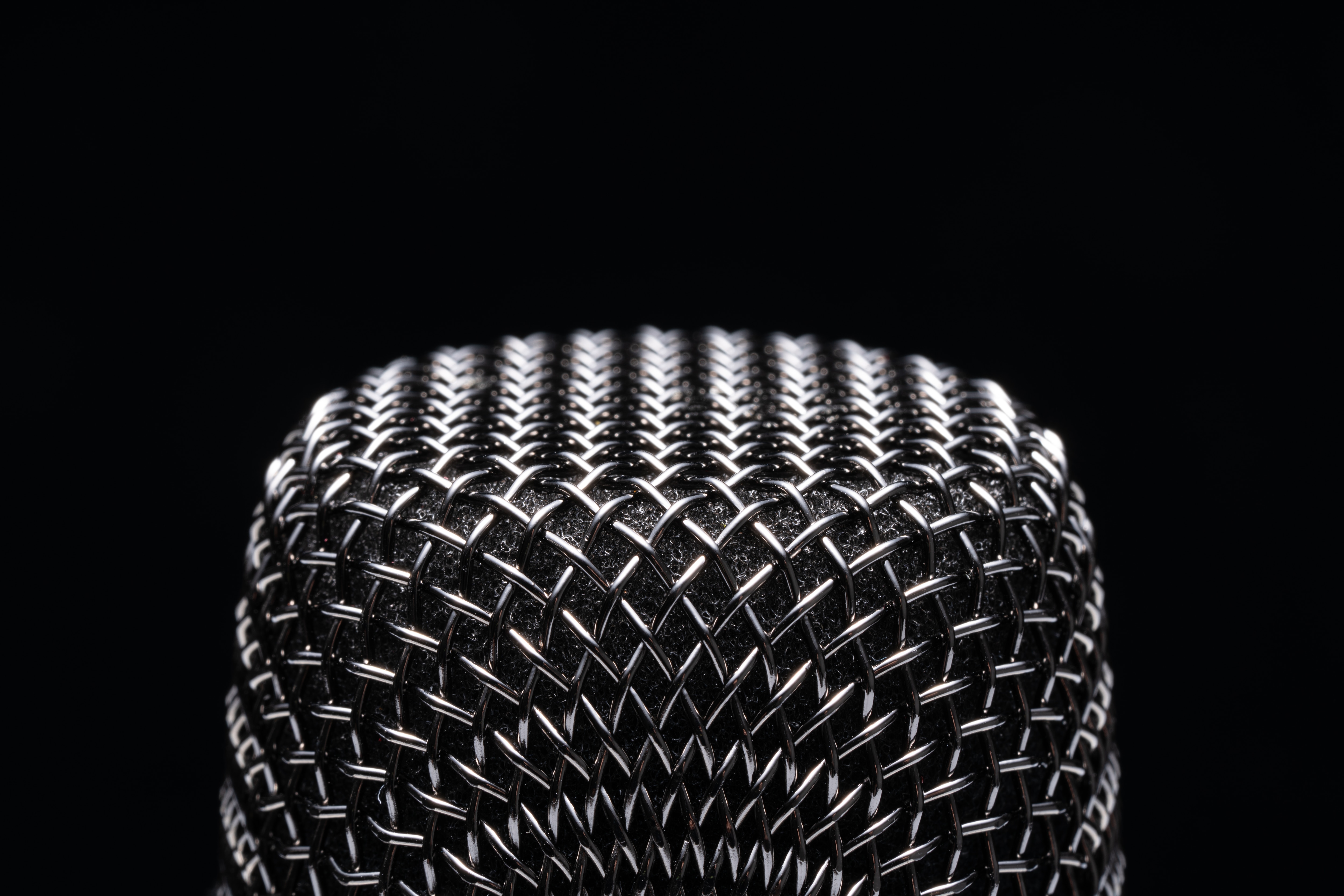 Vocal Microphone on Black Background Extreme Close-up View Macrophotography.