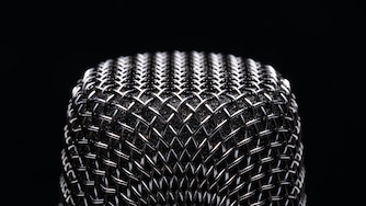Vocal Microphone on Black Background Extreme Close-up View Macrophotography.
