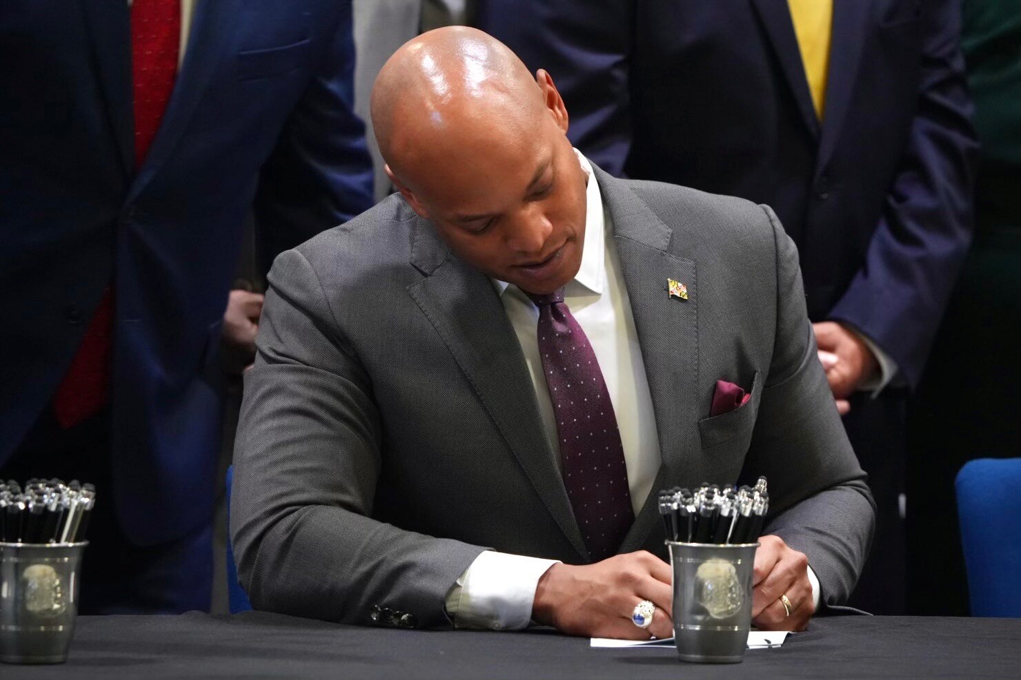 Wes Moore signs bills into law at the 175th Wing Maryland Air National Guard maintenance hangar on May 12, 2023.