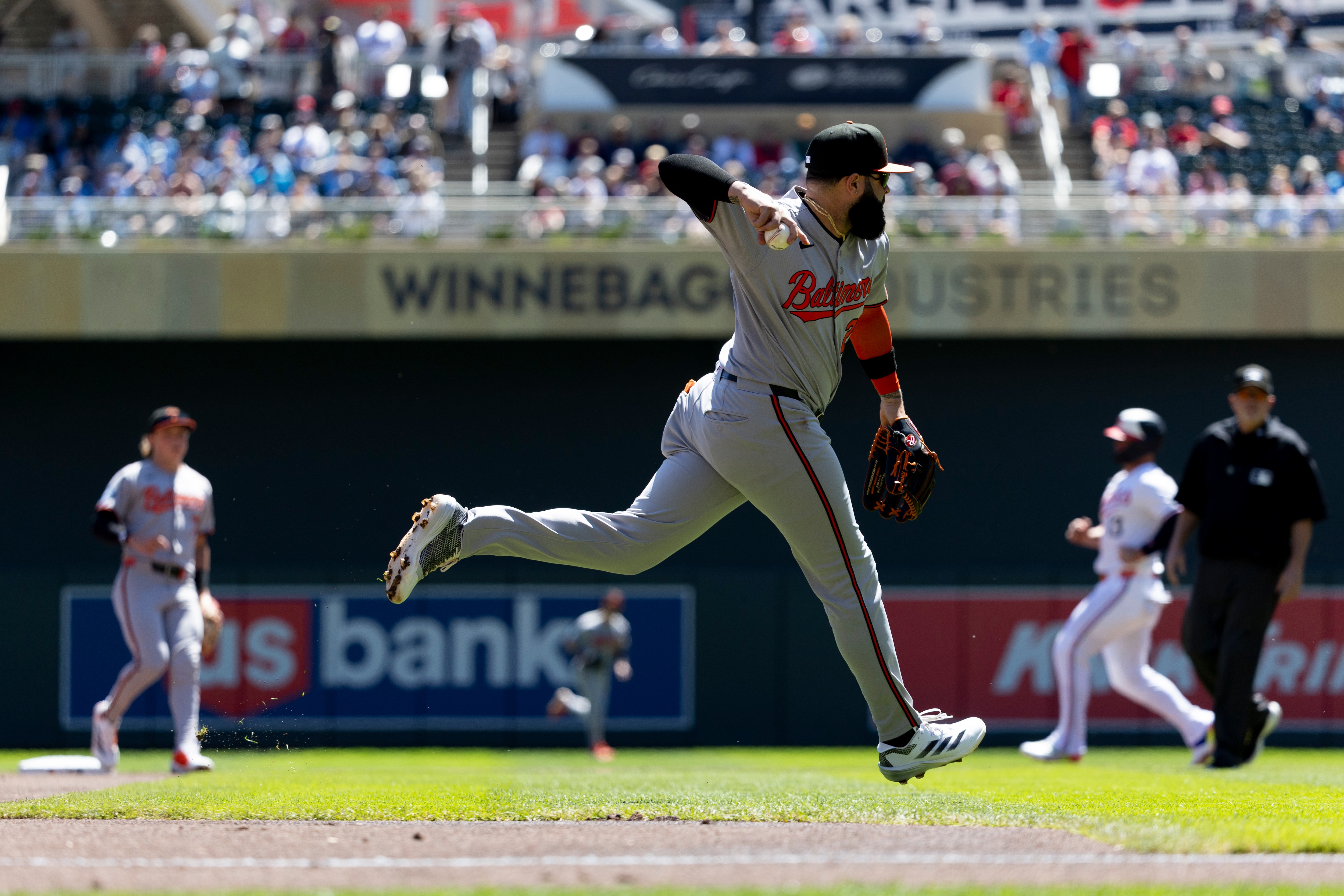 Emmanuel Rivera, who had three hits for the Orioles, fields a ball during the first inning of Thursday’s 5-2 loss to Minnesota.