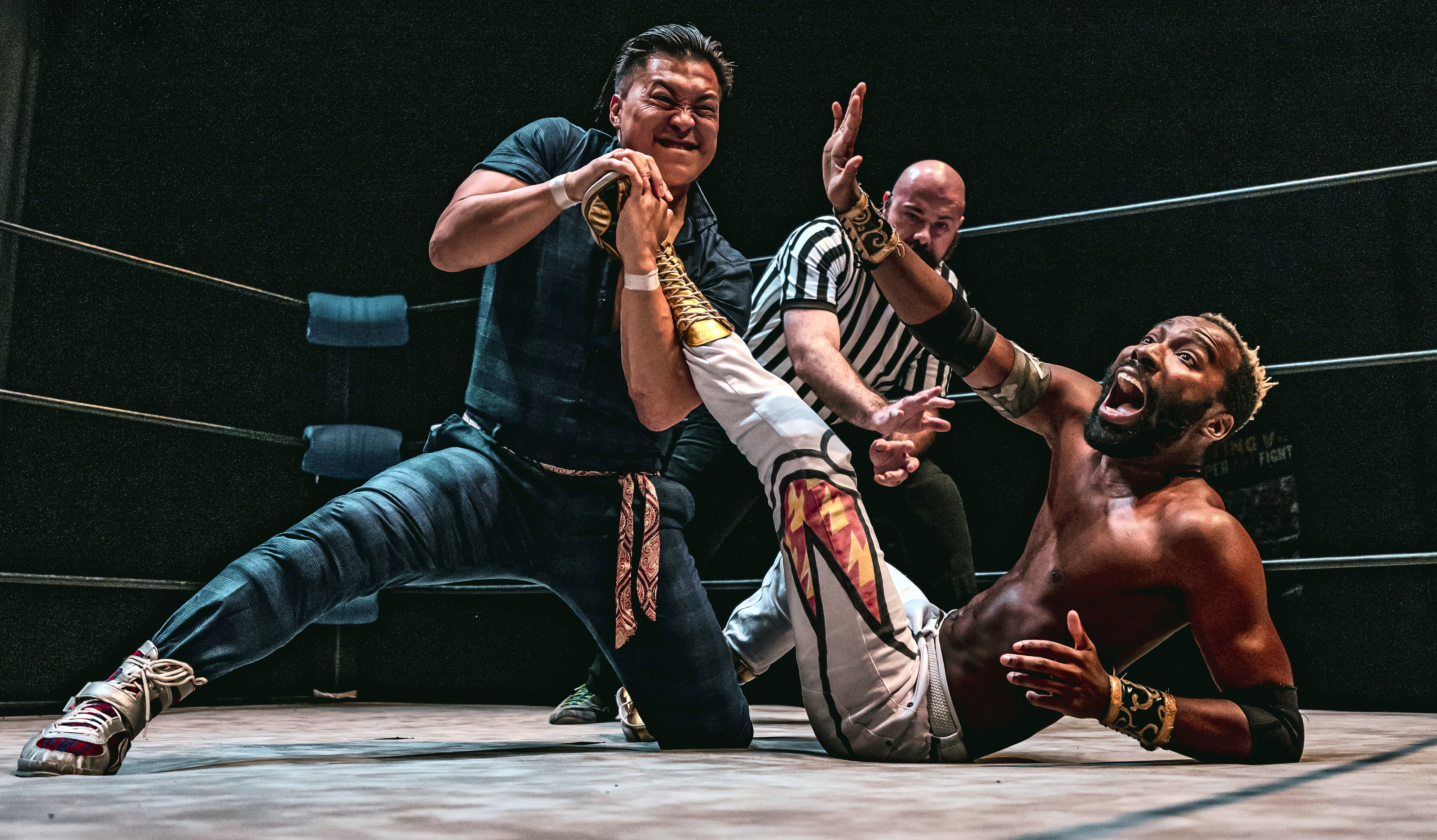 Filipinot Grigio, left, tries to submit “The World Famous” Cheeseburger at Flying V Theatre's "Double Dash II" on May 31, 2025. The two will appear at the nonprofit's "Fighter Fantasy" on Dec. 20 at Silver Spring Black Box Theatre.
