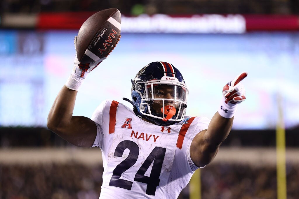PHILADELPHIA, PENNSYLVANIA - DECEMBER 10: Maquel Haywood #24 of the Navy Midshipmen scores a touchdown during overtime against the Army Black Knights at Lincoln Financial Field on December 10, 2022 in Philadelphia, Pennsylvania.