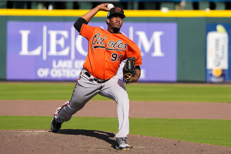 Orioles pitcher Ofreidy Gómez (91) delivers a pitch at LECOM Park in Sarasota, Florida, on Tuesday, Feb. 28, 2023, during the bottom of the ninth inning of a spring training game against the Pittsburgh Pirates. Gómez pitched despite the fact that the Orioles had already lost and the umpires had walked off the field.