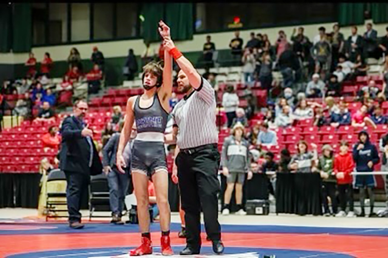 Sparrows Point's Dom Ambrosino has his hand raised in victory following his 120-pound 2A-1A state championship match.