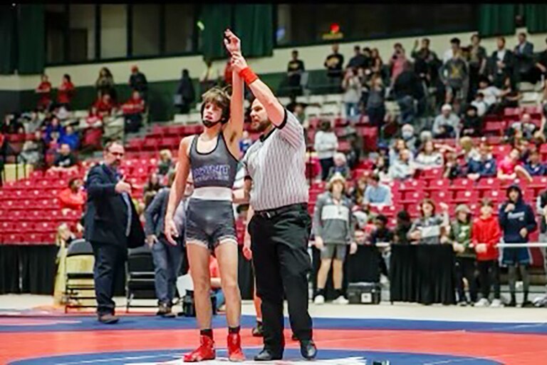 Sparrows Point's Dom Ambrosino has his hand raised in victory following his 120-pound 2A-1A state championship match.