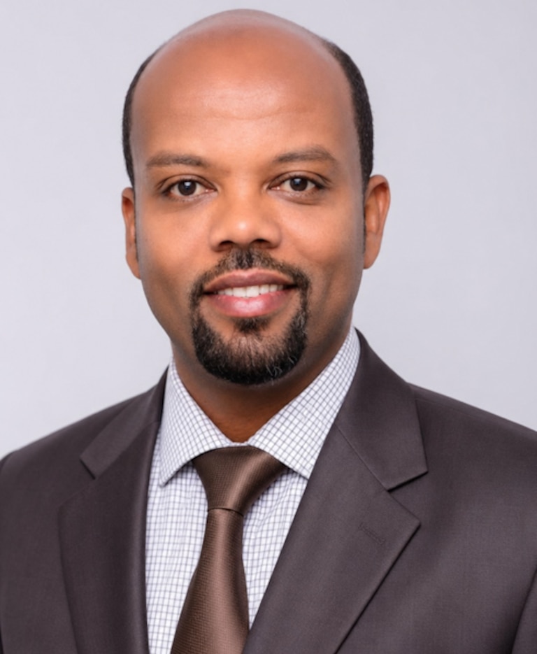 Berhanu Kibret, an instructor at the University of Maryland School of Pharmacy, was arrested by immigration agents at Dallas Fort Worth International Airport on July 21, 2026.