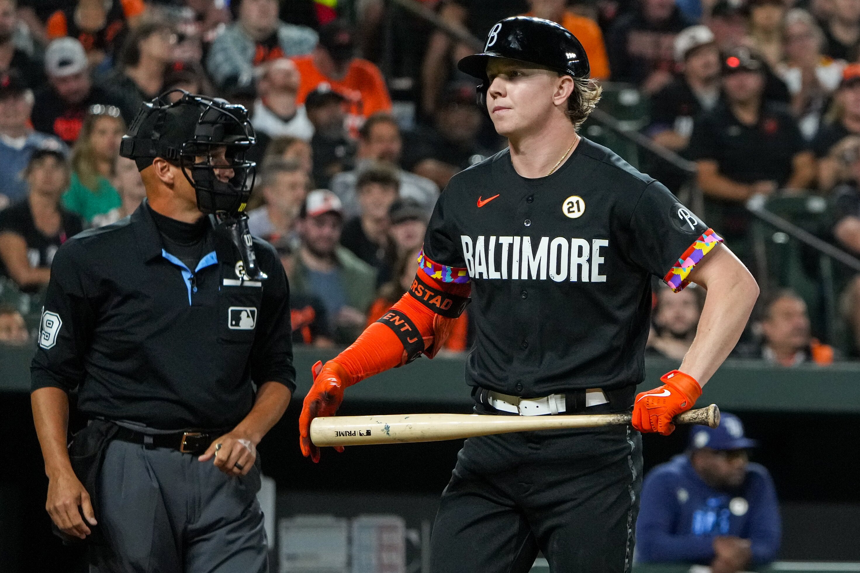 Heston Kjerstad returns to the dugout after striking out Friday night. He later hit his first major league home run to account for the Orioles' only run and one of their two hits.
