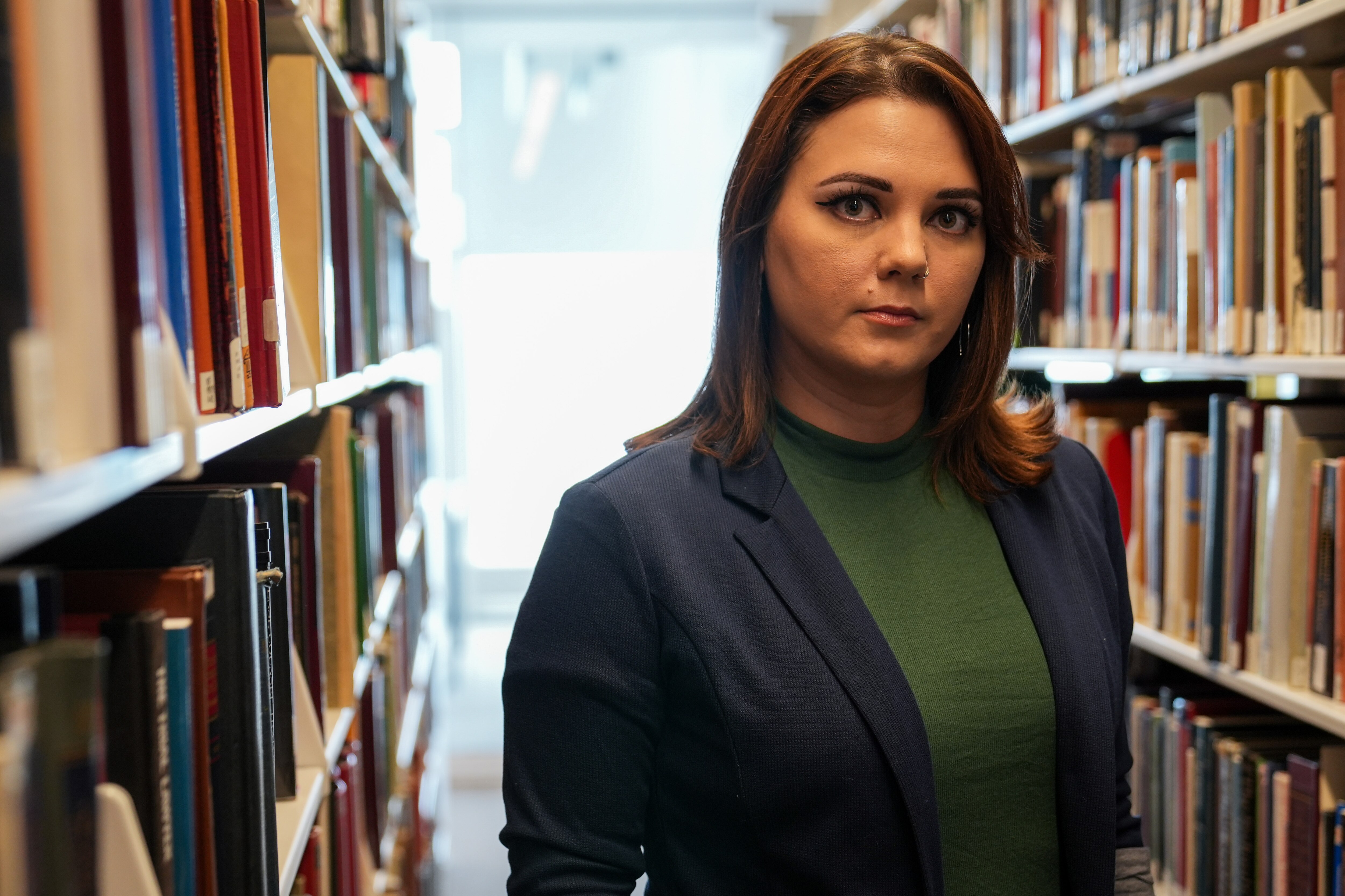 7/8/22—Alexis Martinez, a third year student at the University of Baltimore School of Law, poses for a portrait in the school’s library.
