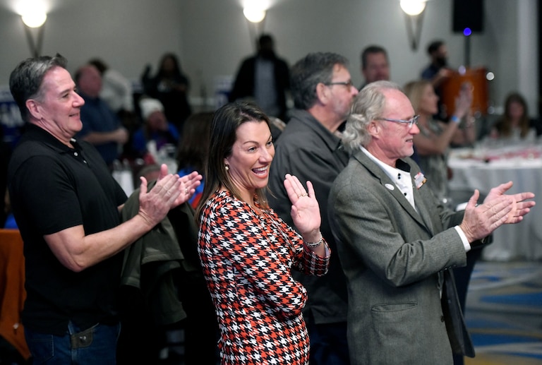 Gordana Schifanelli, center, Maryland's Republican candidate for lieutenant governor, who ran with Republican gubernatorial candidate Dan Cox, not pictured, waves during a campaign results reception, Tuesday, Nov. 8, 2022, in Annapolis, Md.