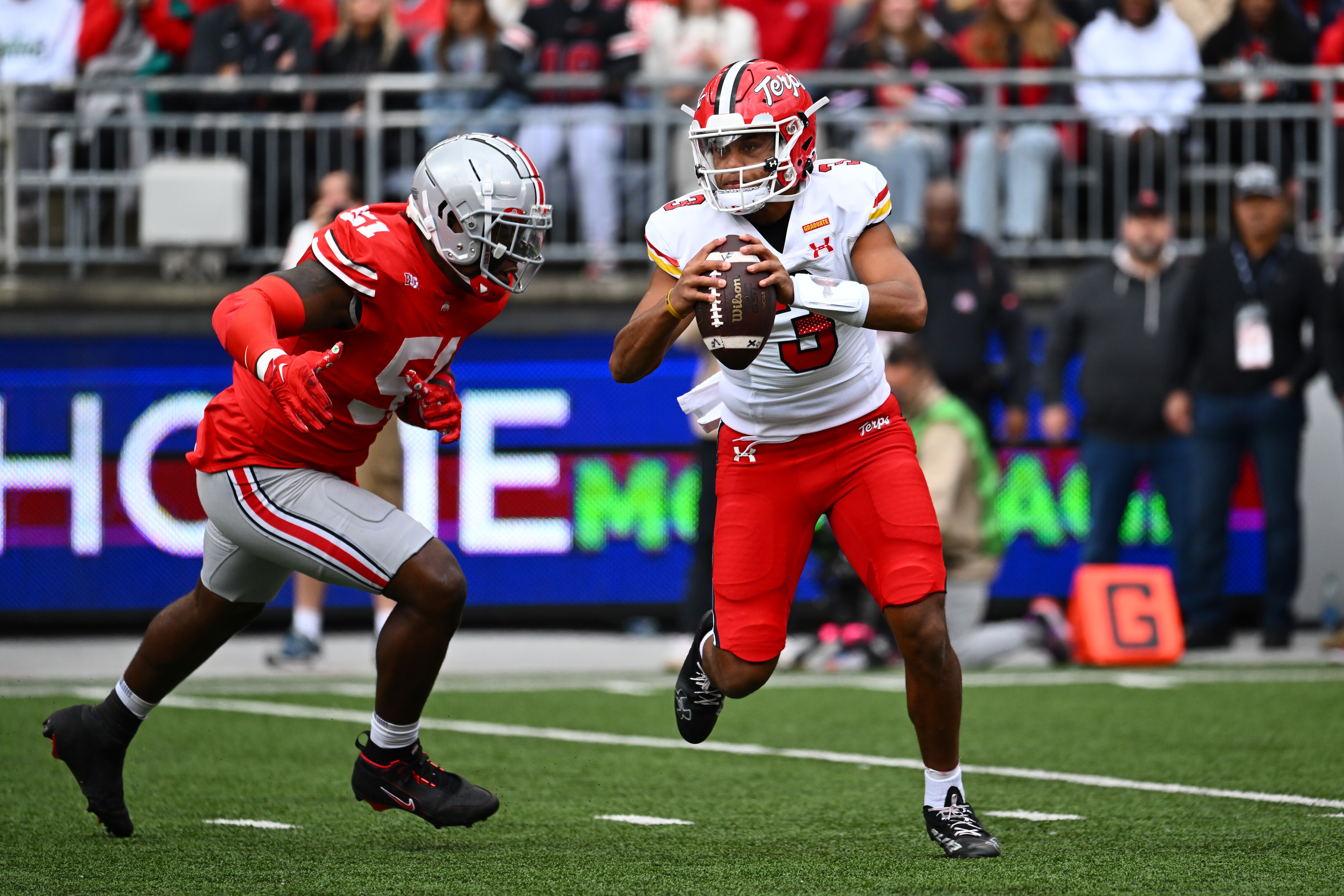 COLUMBUS, OHIO - OCTOBER 07: Quarterback Taulia Tagovailoa #3 of the Maryland Terrapins is pressured by Michael Hall Jr. #51 of the Ohio State Buckeyes during the first quarter of a game at Ohio Stadium on October 07, 2023 in Columbus, Ohio. (Photo by Ben Jackson/Getty Images)